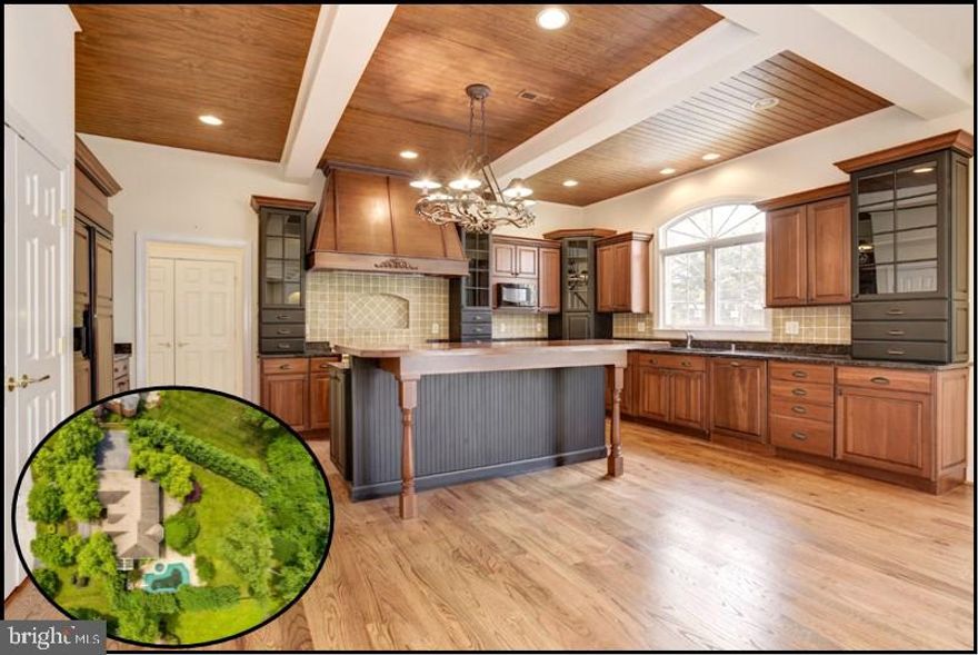 This stunning home is the former model home in the prestigious Pindell Woods neighborhood. With over 2.2 million dollars in upgrades, this home will get approval from even the most discerning buyers. From the moment you walk through the front door you can see the impeccable attention to detail. From the gleaming hardwoods to the elegant curved staircase to the gourmet kitchen - this home has it all! All bedrooms are a very generous size and can fit queen or king sized beds. The over-sized garage can easily fit three large SUVs and there's an additional parking area right outside the garage that can fit another 7-8 cars.... plus an additional circular driveway! The home itself is the centerpiece to this incredible neighborhood, but still offers peace and tranquility with its private setting. From hosting large parties to gathering by the fire to enjoy a movie night in your personal, home theater room, the floor plan is right for any occasion. This is truly a once in a lifetime opportunity! Make an appointment today!