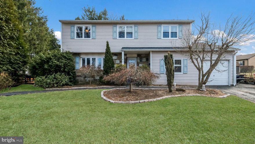 4 BR, 2,5 BA partial stone front Colonial on a large corner lot. Covered front entry leads to formal entry with ceramic tile floor. Formal Living room with a large bow window welcoming in the sunshine & hardwood floors that continue into the formal Dining room with chair rail, crown molding & slider opening to a large deck. Pass through from Dining room leads to Eat-in Kitchen with ceramic tile floor & stainless steel appliances including gas range with range hood & built-in dishwasher. The large Family room is accessible from the Foyer & the Kitchen & offers a tile floor, ceiling fan & stone accent walls. First floor Powder room & large Laundry/Utility room off of Family room with a door to 1-car Garage. The second floor offers a large Primary Bedroom with hardwood floors, a walk-in closet & a full bath with built-in cabinetry & a walk-in tiled shower. 3 additional Bedrooms offer hardwood floors & full hall bath with tub/shower combination. Large 2-tier deck offering a custom covered bar overlooking the large rear yard with a storage shed & separate stone patio. New Roof installed in Nov 2024.