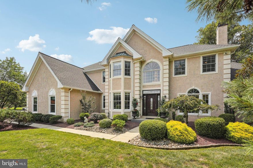 Spacious, Light and Airy Trafalgar House Cedarbrook  Former Model home located in the Holland Ridge sub-division of Northampton, Bucks County, PA.     An enclave of homes built on +/- one acre parcels in the award winning Council Rock School District.   Enter into the dramatic 2 story foyer w/ hardwood flooring accented by a grand turned staircase. The elegant crystal chandelier and a large palladium window provides a lovely sunlit space.  This model offers double doors into a 1st floor library/office.  Formal dining room w/ vaulted ceiling and  transom windows.  You can access the dining room from the kitchen and living room.  Formal living room offers custom, upgraded woodwork.  2 sets of glass french doors  flank the double sided fireplace that is shared with the conservatory and living room. Sun drenched conservatory has a tray ceiling and is surrounded by windows  and nice views of the yard. Upgraded granite island kitchen has solid wood, soft close cabinets, granite counter tops, tile backsplash, upgraded stainless steel appliances, pantry  and hardwood flooring.   There is under cabinet and above cabinet lighting.  Kitchen eating area allows you to exit to the rear custom patio with extensive hardscaping. Convenient built in natural gas grill and burners, 8 person counter seating, enjoy the  fabulous covered wood fired pizza oven  from Portugal.   All within the privacy of your yard.  Spacious 2 story great room with fireplace, sun lights, hardwood flooring, granite counter top wet bar and closet.  Powder room with upgraded tile and granite.   Laundry room off of the 3 car side entry garage with upgraded appliances  complete the 1st floor.  The large primary spacious bedroom has a 3 window alcove with seating area.  There are 2 walk in closets with closet master, linen closet, granite make-up vanity with sink.  Primary bathroom w/ custom tile, stand alone shower and stand alone bath .   Private water closet.  Bright sunny bathroom with 1/2 moon window.  3 additional generously sized bedrooms with double closets. 
Hall bath has upgraded cabinets double sink, custom tile bath and flooring.  Finished basement offers a gym area, a home theatre with seating and fixed screen. Additional space for storage.  This home has newer roof, heating and air, hot water heater, custom motorized roller shades  in most rooms and upgraded lighting throughout.   Outdoor sprinkler system, electric dog fence and a high end Lorex camera system and ring security.  Freshly painted and papered with neutral tones.  It is conveniently located to road, rail and air.  Easy commute to Princeton Route 1 corridor and Philadelphia.