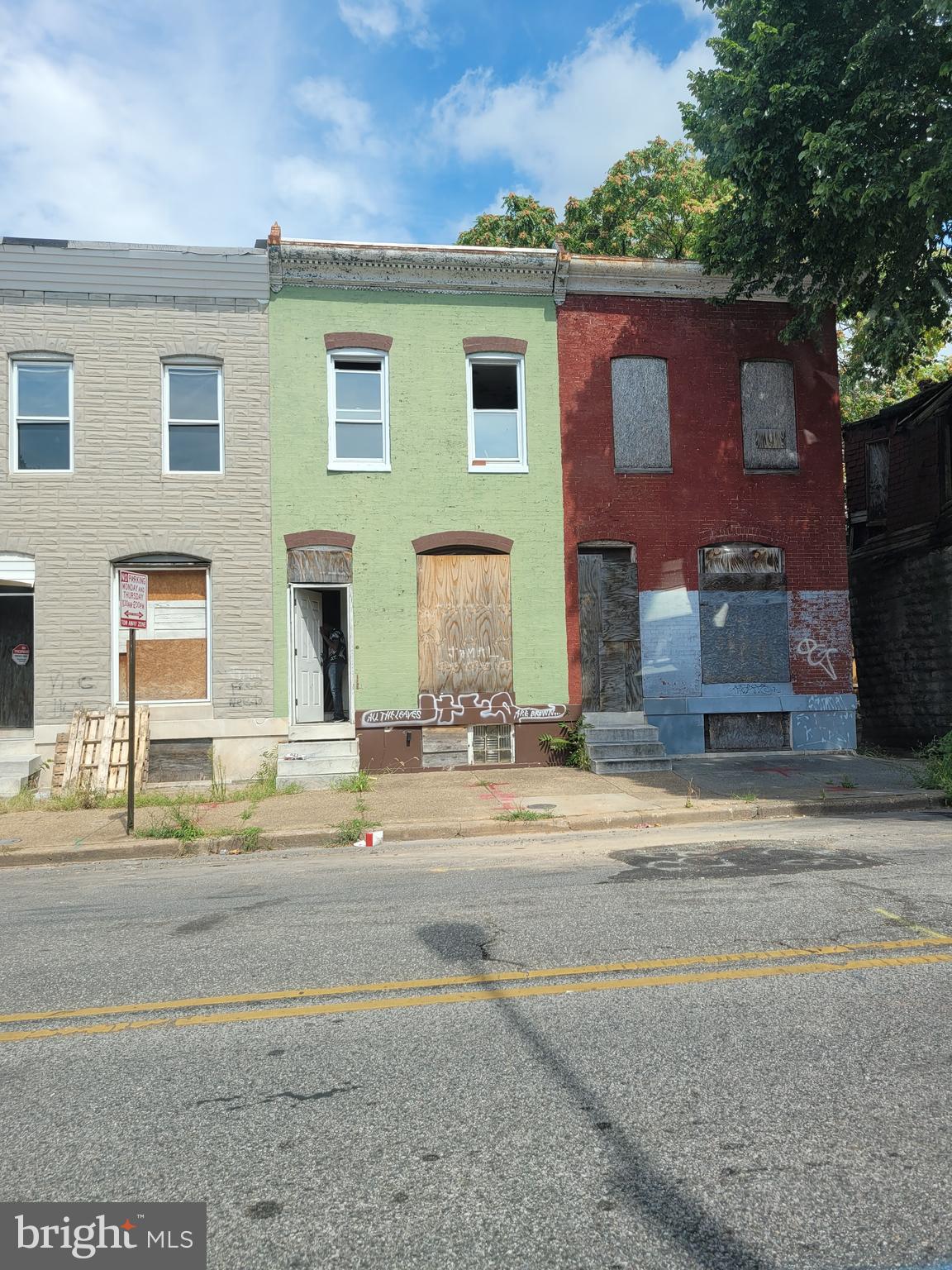 HUGE PRICE DROP! For the serious rehabber only. Renovation block. Renovation under way at #1910 and #1914. 3 bedrooms on 2nd floor. Full bath on second floor, shower bath on first floor, half bath in basement. Roof not leaking. Skylight is leaking. Leak has caused soft spot on stairs. Because of this, seller requests Hold Harmless agreement. See agreement in Documents. He will be present at showing.
Basement has 7.5 foot ceiling height (estimated). Main drain runs underneath the basement floor. No need for ejector pump to have workable bathroom in basement. Low taxes. Ground rent details (payment amount and frequency and payee) unknown. Lots of trash has been removed. Some trash may remain. Sold strictly "as is".