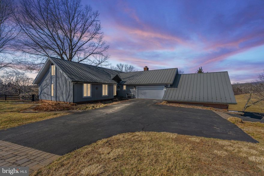 OPEN HOUSE CANCELED.  Sellers accepted sight-unseen offer.  This beautiful, custom-built home will not disappoint!  Immaculately maintained and cared for, this home is sited at the end of a quiet road and just 5 minutes to the town of Warrenton.  It offers main level living with everything you need to live comfortably with no stairs! It has an expansive owners' suite, additional bedroom/library, cozy den off the kitchen, laundry room and large living and dining rooms, all on the main level.   A sweet loft on the upper level provides a quiet oasis, complete with additional bedroom, full bath and den.  The lower level provides a wonderful separate living space with full kitchen, laundry, bedroom, bathroom, living area, tons of storage, sun porch and walkout to your own private patio...perfect as an in-law suite or rental apartment.  There is an over-sized 2-car attached garage and an additional, AMAZING,  2-level garage for the car enthusiast or hobbyist.  Enjoy watching the wildlife from the back deck or patio; garden using the raised beds and enjoy the spectacular setting with scenic vistas, rolling hills, bold stream and privacy!  NO SIGN ON PROPERTY