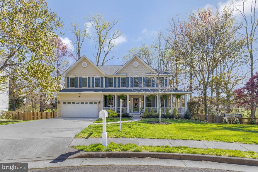 Offer deadline Tuesday 5pm. Welcome home to  Zachary Court nestled in boutique Blooms Crossing. This light-filled home, 3/4 mile from VRE Manassas Park Station, beckons with its serene cul-de-sac setting and lush natural surroundings.
     *.         *.    
Elegance meets functionality in this expansive traditional colonial home, where modern updates harmonize with generous rooms designed for entertaining. From intimate gatherings to lavish parties, revel in the versatility of multiple indoor and outdoor spaces, including a tranquil yard leading to a peaceful creek. Two car garage is EV ready with dedicated breaker.
     *.         *.    
Indulge your culinary desires in the chef designed, multi-zone gourmet kitchen, a culinary masterpiece with top-of-the-line appliances - Wolf double ovens and stove, Bosch dishwasher, Sub-Zero refrigerator. The home has front formal rooms flanking the main floor, and a breathtaking 2-story great room overlooking the yard, and a main floor bedroom with full bath for versatility - every corner of this home exudes sophistication.
     *.         *.    
Retreat to the upper level, with a balcony overlooking the great room where an oversized primary bedroom awaits, complete with a luxuriously renovated bath featuring heated floors, a private WC, soaking tub, large shower, and a walk-in closet. Three additional bedrooms, an updated full bath, and a convenient laundry room complete this level, offering a sanctuary of comfort and style.
     *.         *.    
Descend to the lower level, a paradise for entertainers, with its walk-out access to the stamped patio. Here, discover a wet bar, wine fridge, media center, games area, ample storage, a full bath, and a flexible space perfect for guests or a home office.
     *.         *.    
Outside, the quiet yard envelops you in tranquility, adorned with mature trees, full wood fencing, and landscaped areas to accentuate the natural beauty of the surroundings. 
     *.         *.    
Major upgrades included Kitchen remodel in 2019, Roof and Window replacement in 2020, Primary Bathroom remodel 2024, Main floor bath and second floor bath updates 2023, continuous upgrades as needed and well maintained inside and out.
     *.         *.    
Close to retail and entertainment amenities, and less than a mile from VRE Manassas Park Station, this residence offers unparalleled convenience. Additionally, embrace the new vibrant downtown community, with new features under construction for civic and retail spaces, including an entertainment plaza centered around the newly built city hall and library. Proximity to expansive parks like Signal Hill and Bull Run ensures endless opportunities for outdoor adventures.