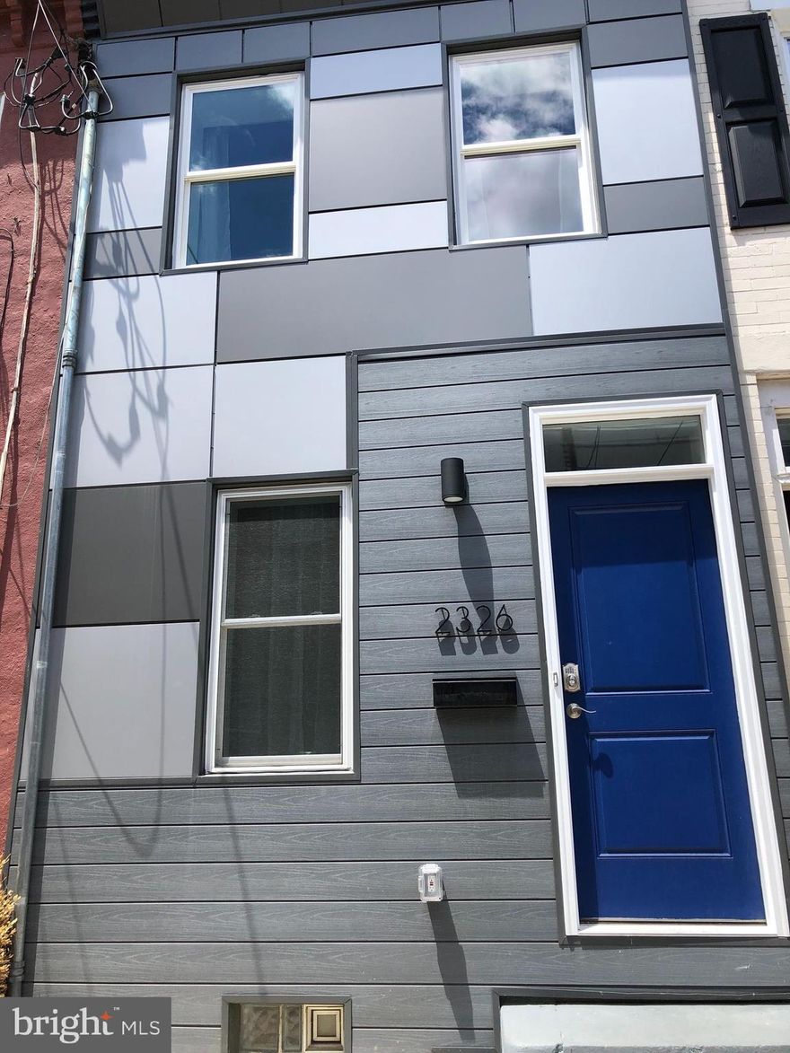 This is another fantastically Rehabbed property in a prime Fishtown Location. The workmanship is impeccable! Located 1/2 Block off East York  St your just steps away from shopping, dining etc, and you have  easy access to major highways.  As you walk into the home, you are greeted with an urban feel of exposed brick walls and new hardwood floors.  The kitchen is all brand new with stainless steel appliances, Quatz countertops, a beautiful backsplash and shaker cabinets.  Conveniently located on the 1st floor is a discretely tucked away Half Bath, coat closet and 1st floor laundry.  The back yard is EXTRA spacious!  The 2nd floor boosts 2 Bedrooms and Full Bath. All hardwood floors on this level as well. The bedrooms both have ceiling fans. Large full clean basement has lot of great storage. All appliances and mechanicals are NEW!  New W/D, HVAC, Water Heater,  electrical, plumbing, roof and all kitchen appliances including Refrigerator, dishwasher, microwave and oven.