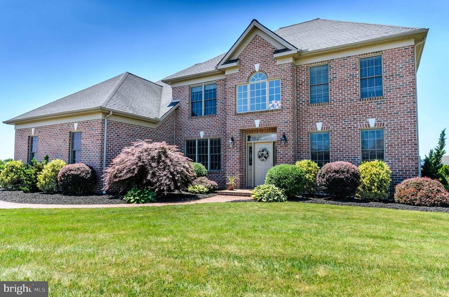 Have it all with this beautiful Brittany home custom designed and built by Jeff Henry!  Exquisite open multi-tier stairway impressively sets the tone for this exceptional home!  2nd story walkway overlooking two story great rm and foyer presents the wow of architectural design!  Kitchen boasts custom cabinetry, granite countertops, stone backsplash, porcelain tile fl, reversed osmosis water on tap, and a French door slider to pool side!  Classic Brazilian Cherry wood floors enhance first floor office, and formal dining room with tray ceiling, crown, picture framing, and indirect lighting.  Large master bath with large tile shower & large walk in.  2nd master bdrm.  Home theater room. Enjoy outdoor living & offer the best of entertaining opps w/ 3 yr old saltwater heated pool beautifully illuminated w/ laminars,  intelatouch automated panel & LED lighting!  Bask on pool patio w/ landscaping,  and like new retractable awning!  Truly must see!