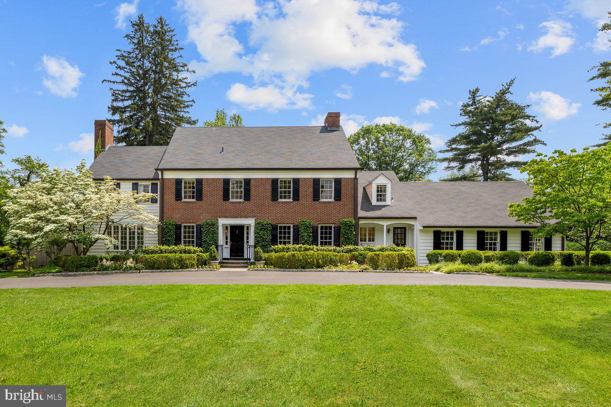 Elegant Colonial Retreat in Princeton’s Most Coveted Location
Set on 2.3 meticulously landscaped acres in one of Princeton’s most prestigious neighborhoods, this stately Colonial residence blends timeless architecture with exceptional modern comfort. With 5 bedrooms and 4.5 bathrooms, the home offers refined living spaces perfectly suited for both everyday life and sophisticated entertaining.
Inside, natural light pours through oversized windows, highlighting gleaming hardwood floors and spacious, thoughtfully designed rooms. The expansive family room, anchored by a classic wood-burning fireplace, invites cozy gatherings, while multiple sets of French doors open to a serene backyard—ideal for effortless indoor-outdoor living.
At the heart of the home is an open-concept kitchen that combines form and function, featuring ample workspace and seamless flow into adjoining living areas. The main level also offers a flexible office or fifth bedroom option, complemented by a full bathroom and an additional half bath—perfect for guests, multigenerational living, or working from home.
Upstairs, three generously sized bedrooms and a full bathrooms along with an expansive primary suite that offers his and her bathrooms and ample closet space.
Step outside to discover your own private oasis: a bluestone patio covering the entire width of the building with entry from every room overlooking a sprawling backyard with a sparkling in-ground pool, framed by mature trees for maximum privacy and tranquility. Whether relaxing poolside or entertaining on the lawn, this outdoor setting is truly special.
Additional highlights include a circular driveway, abundant natural light throughout, and a prime location just minutes from downtown Princeton, top-rated schools, and renowned cultural institutions.