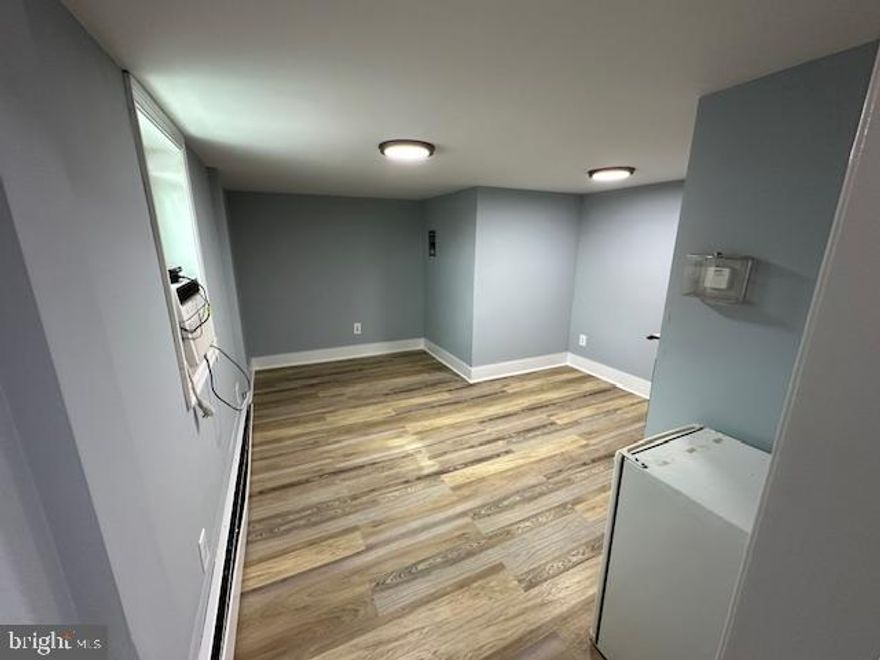 Studio Apartment - All utilities and cable are included. This is not a room share. Apartment has private bath and air conditioning. This small efficiency has a refrigerator and microwave. Freshly painted with new LVL flooring. Coin laundry available onsite. Off-Street parking included.   Excellent location. Close to public transportation.  Located on a commercial property with 18 residential units.  Must have good credit with no history of evictions or failure to pay rent filings to be considered.