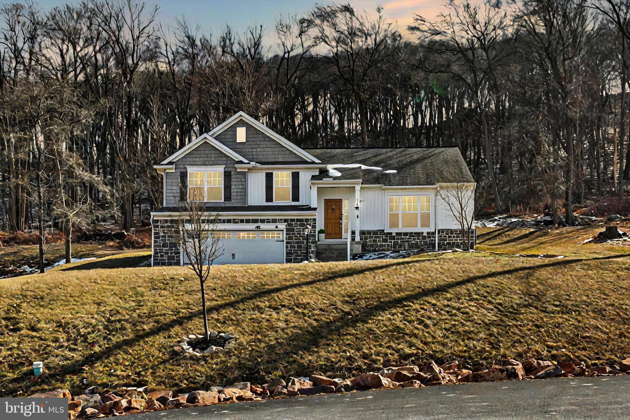 PRICE REDUCED !!! Welcome to your dream home! This stunning Crawford model by Garman Builders, nestled in Rockville Estates, is ready to move in and offers a fresh take on the multi-level floor plan. As you step inside, you're greeted by a vaulted ceiling in the living room, a cozy gas fireplace, and gorgeous hardwood floors leading to the kitchen. The living room features brand-new carpet and fresh paint, creating a warm and inviting atmosphere. Bay windows will fill the space with natural light, showcasing breathtaking views. On the upper level, the beautifully designed kitchen and dining area feature a spacious island—perfect for entertaining. White cabinetry pairs elegantly with granite countertops and stainless steel appliances, along with a newly installed kitchen hood. The open layout is ideal for holiday gatherings or Sunday game nights!
The Master Suite boasts dual sinks and a walk-in closet, while two additional bedrooms, a full bath, and a laundry room complete this level. Downstairs, a spacious family room doubles as a playroom, with a mudroom leading to the garage, a fourth bedroom, and another full bath.
Outside, enjoy a newly landscaped yard and a backyard concrete patio—perfect for BBQs and outdoor entertaining. The wooded backyard provides added privacy, making this home a true retreat.
Don't miss this move-in-ready home! Schedule your showing today!