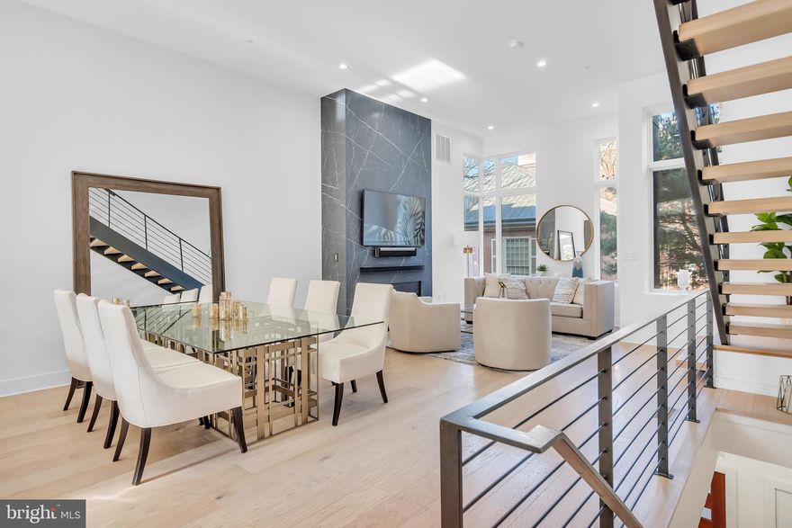 This stunning home is a must see! Welcome to 48 N 3rd Street in the heart of Old City. This home is enclosed in a gated community with a private entrance which is the perfect oasis away from the hustle and bustle of the city and backs up to a historical site. Enter the home through the front door from a private lane or through the 2-car garage. Once inside you will be blown away by the open concept floor plan that is perfect for entertaining. The beautiful floor to ceiling quartz fireplace, with a steel mantle, was recently installed. The contemporary, light-filled space flows seamlessly to the gourmet chefâs kitchen with state-of-the-art Wolf/Sub-Zero appliances, granite countertops, and access to a private balcony which is lined with custom planter boxes, equipped with an irrigation system. The second floor features two large bedrooms with custom walk-in closets and en-suite bathrooms. A full-size laundry room is also on this floor. Upstairs on the third floor, enjoy the gorgeous primary suite which boasts a generous walk-in closet, newly installed motorized window shades, and a spa-like bathroom featuring custom tiling, a double vanity, a free-standing soaking tub, and a large glass enclosed shower. Take the private elevator up to the roof deck where you will find a newly installed outdoor kitchen and beautiful views. The pilot house is also equipped with a wet bar, lounge area, and half bath. For additional living space, this home has a finished basement with a newly installed video wall with built-in speakers, a full bath, and extra storage. With gorgeous hardwood floors throughout, high ceilings, an elevator, speaker system, and an alarm system, what more could you ask for? Enjoy being within walking distance of the shops and restaurants in Old City. The tax abatement on this home expires on December 31, 2028.