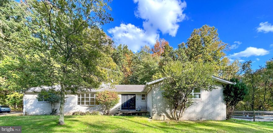 List price is Opening Bid At The Online Only Auction Sale. Online registration & bidding begins Thursday, October 26th and ends Tuesday, October 31, 2022 at 12:00pm. Estate Sale of a Spacious Mid-Century Rancher on 3.4± Acres, Features a Private Setting with a Swimming Pool, Located "Caves Park". The home includes 2,732± above grade square feet, 4 bedrooms, 3 full baths, and an unfinished lower level. The main level of the home includes an entry foyer, living room with a fireplace, kitchen, breakfast room, formal dining room, a large enclosed sun room, and a laundry room. The main level includes 4 bedrooms and 3 full baths. There is a primary bedroom with an en-suite primary bath. Features Include an attached oversized 2 car garage, long driveway with ample parking, in-ground gunite pool, pull-down attic with storage, storage shed, and a private property overlooks trees. The home is in need of updating and has tremendous potential.