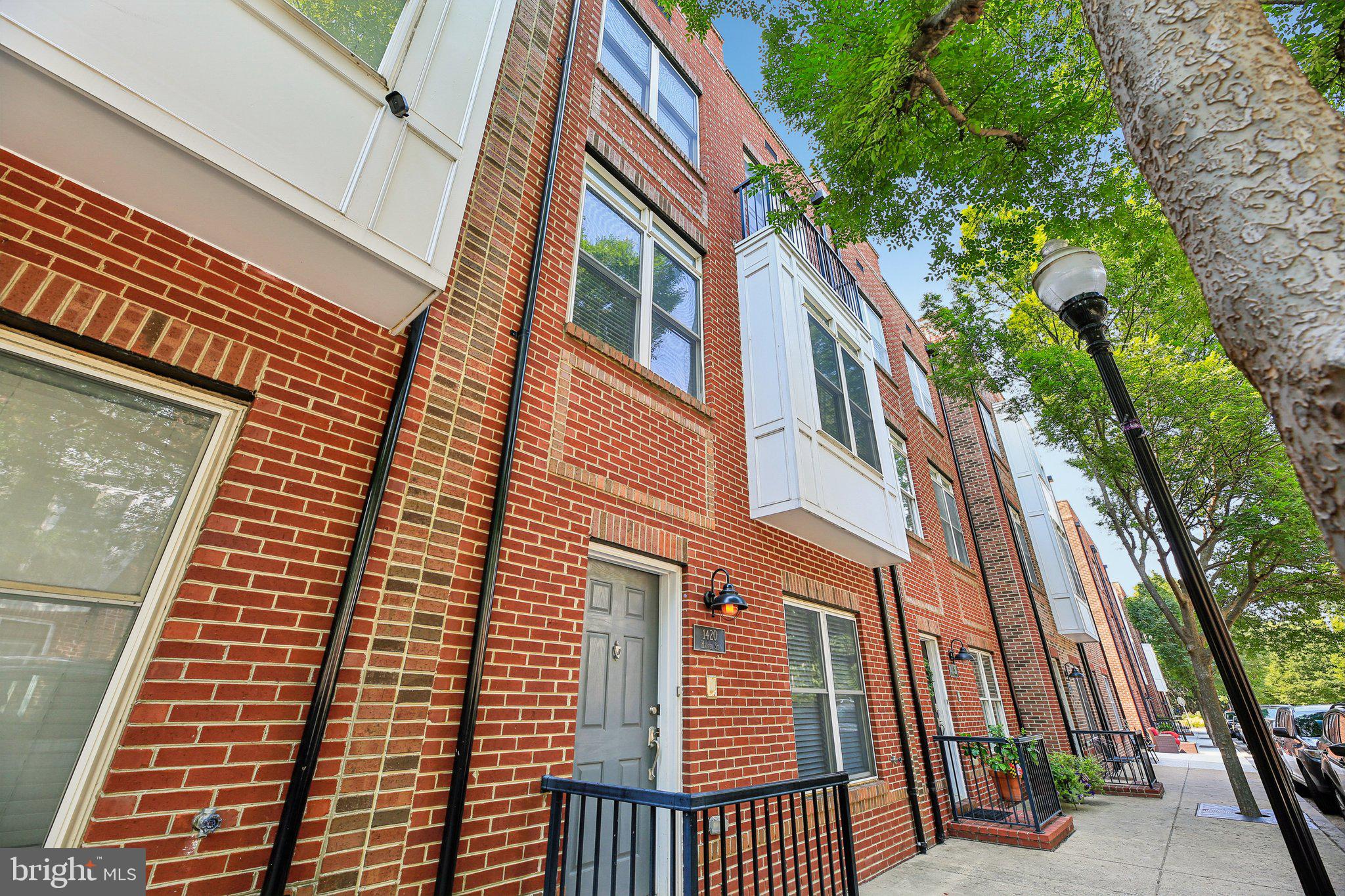 Beautiful 4 bed, 3 bath brick-front rowhome in Locust Point, offering spacious, modern living with classic charm. The main level boasts gleaming wood floors, crown molding, chair rail detailing, and a formal dining area perfect for entertaining. The kitchen is outfitted with stainless steel appliances and granite countertops. The entry level features a dedicated office space, while the third floor includes a wet bar area with sink and cabinetry leading to a private rooftop deck with sweeping city views. The spacious primary suite includes a soaking tub and separate standing shower. A rear-entry garage provides convenience and additional storage. Enjoy easy access to Latrobe Park, off-leash dog park, and Francis Scott Key Park with picnic areas and harbor views—all in one of Baltimore’s most vibrant and walkable neighborhoods. Don't miss this Locust Point gem that blends its historic roots with modern amenities, offering residents and visitors a unique urban experience.