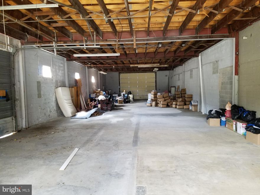 This is part of the building at 914 Eastern Shore Drive. The property was originally a body shop facility in two sections. The "A" section at 914 Eastern Shore Drive Unit A was converted to a professional medical office. The 2700 sq ft unit "B" section was left as a partially finished warehouse. This "B" section is what is being offered for lease. --------------

The 2700 sq ft section is approximately 95.5' x 28.5' interior wall to wall (2700 sq ft+/-). Zoning is City Of Salisbury General Commercial. A copy of the zoning code is in the documents section. There are 2 overhead doors. The one facing the rear parking lot is 12' high x 16' wide. The overhead door facing the south side driveway is 10' high x 12' wide. There is a bathroom in the facility but it is not connected. The Landlord will connect electric to the unit but beyond that, the space is being delivered and leased "as is". If a Tenant wants to undertake their own improvements we can have that discussion.  Per the overhead aerial view, the rear parking lot is mostly occupied by patients 9-5 weekdays. This is why we are primarily looking for warehouse users with limited on-site parking requirements.  --------------

Given that this space is immediately adjacent to their medical offices the Landlord will be somewhat selective as to what uses they will allow. The space is being marketed as basic, drop-storage warehouse space. The GC zoning allows for a wide range of uses. The Landlord may entertain other uses than pure warehouse but they will have to be compatible with the existing, adjacent office use in terms of not causing any disturbance to that use.