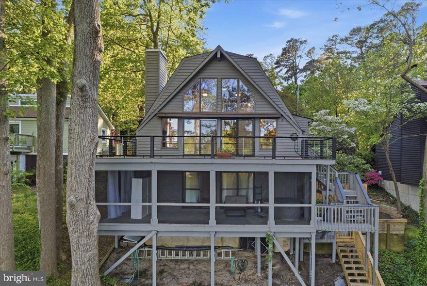 **BRING THE BINOCULARS** Waterfront contemporary with spectacular Chesapeake Bay sunrises and wildlife action is now available to the next Lake Charming enthusiast! This 3BR/2BA home, complete with  loft, deck, and screened porch is nestled on waterfont lot in the sought-after Drum Point community. More special features include a private side garden, wood ceilings, updated decking with cable rails, a propane fireplace, hardwood flooring on the upper two levels of living space, workshop and hobby space. The kitchen is larger than you'd think, with propane cooking and incredible amount of cabinet space and counter lengths! Nature abounds, with bald eagles, buffleheads, herons, and osprey as regular or seasonal neighbors. The private grounds are ready for your garden vision, offering peaceful views from the house overlook. Enjoy the very walkable community, wide roads, and quick access to nearby community beaches. Fishing gear, kayaks, canoes, SUPs welcome. This is a genuine waterfront sanctuary, and a perfect choice for a getaway or permanent home!
