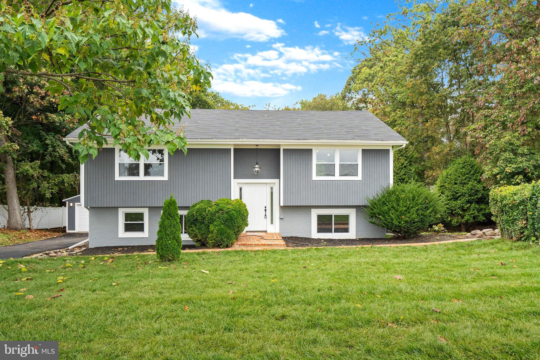 Welcome home! This gorgeously renovated home is a dream come true. Nestled on an almost two acre wooded lot in Parkton, this home has it all. Vinyl plank flooring throughout, airy open floor plan, recessed lighting, additional stylish light fixtures, and modern window/door trim are just a few of the many features this home bestows. Prepare your favorite meal in the stunning kitchen finished with stainless steel appliances, quartz countertops, an island, farmhouse sink, and ample two toned cabinets. The luxuriously sized primary suite is a fabulous retreat complete with remarkable closet space. Step through the stylish barn door into the ensuite bathroom embellished with gorgeous custom tile work, with spa-like features featuring a rain shower head in the oversized shower. Three additional bedrooms, recreation room and full bathroom complete the lower level and are ideal for entertaining guests. Step out onto the deck, overlooking the spacious backyard with trees as far as the eyes can see or relax on the patio, and roast marshmallows in the firepit. This home is complete with a large driveway leading to the detached two car garage, what more could you ask for? Schedule your showing today!