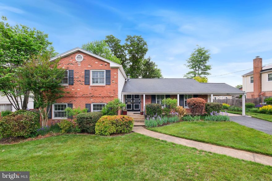 Discover 8815 Postoak Road, a beautifully maintained brick home in Potomac’s sought-after Highland Stone neighborhood, located in the highly desirable Winston Churchill High School cluster. Offering 3,080 total square feet, this five-bedroom, two-full-bath, one-powder-room residence combines timeless character, abundant natural light, thoughtful updates, and exceptional indoor-outdoor living on a private, landscaped quarter-acre lot. Sun-filled interiors, expansive windows, hardwood floors, shutters, recessed lighting, and a spacious multi-level layout create a bright, welcoming atmosphere designed for both comfortable daily living and effortless entertaining. The backyard retreat is a true standout, featuring an expansive walk-down deck, multiple access points from the home, mature trees and established landscaping, garden beds, and generous level green space ideal for relaxing, entertaining, or play. The private setting offers a peaceful extension of the home’s living spaces. The main level showcases vaulted ceilings that enhance the airy feel of the living room, dining room, and updated kitchen. Natural light pours through oversized windows, while the main living spaces transition seamlessly to the rear deck and backyard beyond. The kitchen features granite countertops, rich cherry cabinetry with under-cabinet lighting, stainless steel appliances, a Thermador cooktop, Bosch dishwasher, built-in microwave, and a peninsula with breakfast bar seating accented by contemporary pendant lighting. Just a few steps down, the inviting family room centers around a wood-burning fireplace and opens to the fully fenced backyard through elegant French doors, creating an ideal gathering space year-round. This level also includes a powder room and a flexible fifth bedroom or office with a private side entrance—perfect for guests, remote work, or multigenerational living. Upstairs, four generously sized bedrooms each feature hardwood floors and ceiling fans, including the spacious primary suite with an attached bath, dual closets, and convenient linen storage. The unfinished lower level offers abundant storage and outstanding potential for a future recreation room, gym, workshop, or customized living space tailored to your needs. Lovingly maintained and thoughtfully updated over the years, recent improvements include Andersen upper-level windows (2024), AC compressor replacement (2019), hot water heater replacement (2015), and additional system updates. Conveniently located near dining, shopping, parks, recreation, commuter routes, public tennis and basketball courts, and nationally rated golf courses, this move-in-ready Potomac home offers the ideal combination of comfort, flexibility, privacy, and access to one of Montgomery County’s most sought-after school clusters.