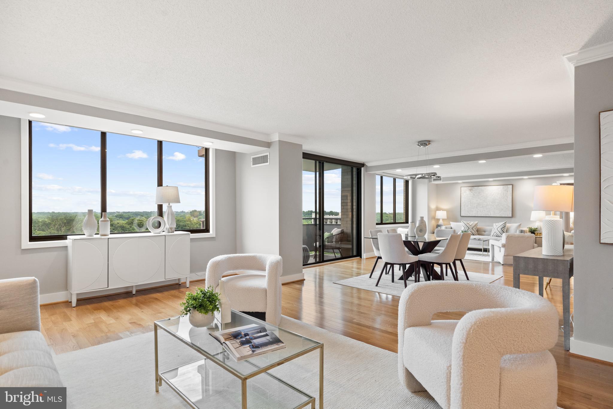 Stunning, very large, one of a kind unit just under 2000 sft at the Promenade Towers with 3BR/2BA. Most desirable, quiet location in South Tower with gorgeous pool view. State of the art kitchen, open floor plan gleaming hardwood floors throughout and the most stunning views imaginable from all rooms with walls of windows and light and charming little balcony off dining area. Beautiful main bedroom suite with large walk-in closet and second balcony. Large laundry area, kitchen with breakfast bar and tons of storage, open living-dining area plus den with entertainment/TV space. Lots of storage and closets throughout. Unit is in pristine, move-in condition - all renovated - in a building that offers any and all amenities you could wish for - it truly feels like living in a resort. Large outdoor as well as indoor pool, fitness center, tennis courts, shops, stores, all in the building. Unit comes with two garage parking spaces. Building is located in close proximity to Metro, transit, major thoroughfares, shopping, entertainment, dining and two major airports! ALL TAXES UTILITIES AND CABLE INCLUDED IN FEE!
Easy living in full service building - lock the door and travel - have no worries about anything - City Living at its Best!