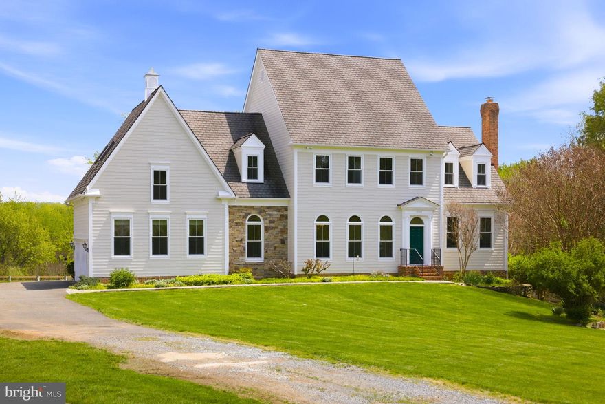 Buyers circumstances changed so you are in luck-Outside the historic village of Waterford Va. set on 10 private acres of rolling pasture and mature woodland, this exceptional residence offers a refined blend of timeless craftsmanship and elevated country living. A resort-inspired pool with a striking dark-bottom finish—enhanced by extensive upgrades completed in 2025—is thoughtfully integrated into the natural landscape, while dual Trex decks overlook lush grounds, creating a seamless indoor-outdoor lifestyle ideal for sophisticated entertaining. Inside, rich American cherry floors, soaring ceilings, and artisan-crafted millwork define the home’s elegant character, enhanced by fresh paint throughout and all new windows and exterior doors. The sun-filled eat-in kitchen, appointed with new appliances, opens effortlessly to the deck, while the sunken family room—anchored by a dramatic stone fireplace and custom built-ins—features a wall of glass framing sweeping pastoral views. A gracious living room with fireplace and built-ins, along with a private study opening to its own deck, provide both intimate and formal living spaces. The upper level offers three luxurious ensuite bedrooms with walk-in closets, complemented by an expansive skylit bonus room. A walk-out lower level with laundry and abundant storage opens directly to the pool and gardens. Additional amenities include a run-in shed with electricity, a detached workshop with loft, an attached two-car garage, and a well-maintained HVAC system (approximately 7 years old)—completing this rare offering where privacy, beauty, and thoughtful design converge.