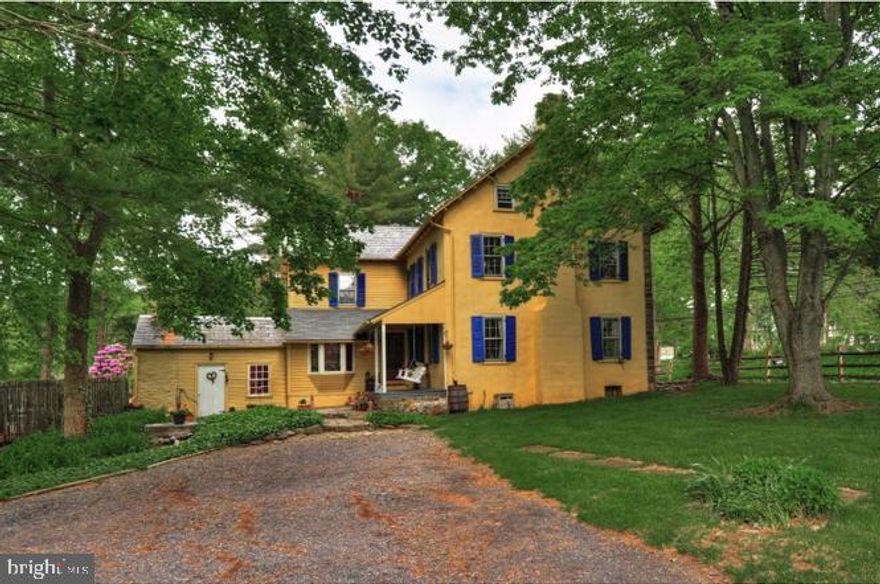 This charming stone home  was established in the 1800's and offers a beautiful blend of the bucolic bucks county character, boasting pumpkin pine flooring, exposed beams and serene views .  This  5 + acre mini farm  is surrounded by preserved  land. This homestead's owner has bundled a treasure trove of its history to lovingly pass onward. This peaceful home has nature sightings, gardens and opportunities for camping, retreats, yoga and drum circles, whatever your heart desires to reconnect with nature, yet offers the convenience to major roadways such as 663, 309 and the PA Turnpike. There have been renovations and improvements throughout. Following the stone walk way to the delightful breeze on the open porch, you will then be delighted by the quaint county kitchen with terra-cotta tiling, custom cherry cabinets, tile back splash, center island and eat-in breakfast nook by the fantastic summer kitchen. The summer kitchen is currently used as an office, guest bedroom  with that warm walk-in fireplace. The Family room is located off the kitchen and is surrounded with natural light from the windows and rear facing sliders. The sliders open to the in-ground pool and outdoor entertainment area with views views views. The main part of the original home shows the  random width pumpkin and wood plank flooring. The Dining Room and Study have adorable tucked pocket doors.  The formal living room has  a stone fireplace and window ledges for books and pillows to cozy up with. The 2nd floor can be accessed  either by the main stairwell or kitchen. The upper rooms have a variety of breathtaking stained glass windows, exposed beams, deep window sills, wainscoting and built in bookshelves. The main bedroom has a toasty  stone fireplace, sitting area and a full bathroom with tons of natural morning light. The second bedroom is over sized and includes a sitting area that connects to a Jack and Jill  bathroom. The third bedroom has a spindle railing and light up stain glass cubby.  There are outbuildings located on the property including a 3 stall barn and fencing area for your riding or animal area. There is a finished, heated studio with new windows, heat and flooring for farmer market style events, office, meeting place or workshop. The barn and lean too offer storage, car enthusiast space, an opportunity for a vacation or weekend retreat rental, home occupation and more! Many updates and upgrades recently improved. The well pump and line replaced, studio has heat, upgraded electric wiring, outlets. Kitchen cabinets boast original glass. The New Yorker heating system has been maintained well and the home has a one year warranty.  With a strong deposit a rent to own is possible.