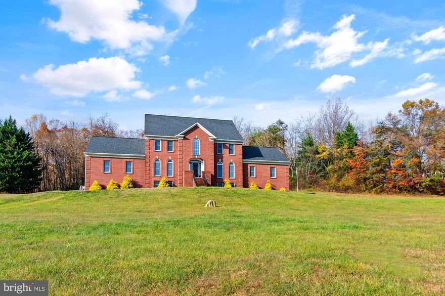 WOW!!! THIS REMARKABLE HOME JUST RECEIVED AN INCREDIBLE FACELIFT!! Welcome to your dream home on a very private & quiet street! This magnificent, very large brick colonial house offers ample space and flexibility with its impressive 7 bedrooms and 6 baths. The layout boasts 5 bedrooms on the second floor, 4 bedrooms on the main level, and an additional bedroom in the basement. Situated on over 3 acres of land, the property provides a sense of privacy and tranquility. Inside, you'll find a spacious eat-in kitchen perfect for gathering and entertaining. The home features a grand two-story main living room, as well as a dining room and foyer, creating an elegant and inviting atmosphere. Don't miss the opportunity to make this versatile residence your own!