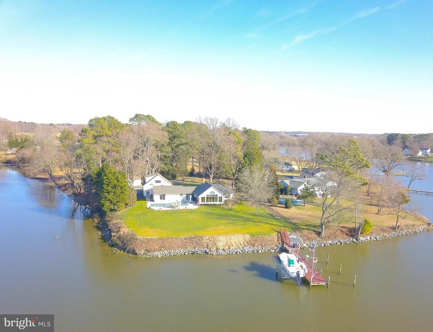 Welcome to Blue Heron Cove on Glebe Creek.  This offering has it everything on a buyers list!  Offered now for the first time, family owned since it was built in 1958.  Meticulously maintained throughout the years and improved with modern features.  Amazing 1.25 acre waterfront point with 4.5 MLW , dockage, 2 slips, 5 T. boat lift.    Quick sail to Miles River.    Waterside  gunnite  inground  pool.   Situated just minutes from Easton and St Michaels amenities.  Boasting 3488 square feet of panoramic views of Glebe Creek and Western exposure for the most stunningly dramatic sunsets.   This house is designed for entertaining with a vaulted ceiling great room, kitchen with island and views, views, views from every room! Split floorplan with primary ensuite bedroom poolside and 2 guest bedrooms and full bath on opposite side of house.   Large water view room above the garage is multi-purpose, currently used as office. Enjoy great storage with a partial basement.  2 car attached garage and additional shed.  New roof and skylights 11/2023