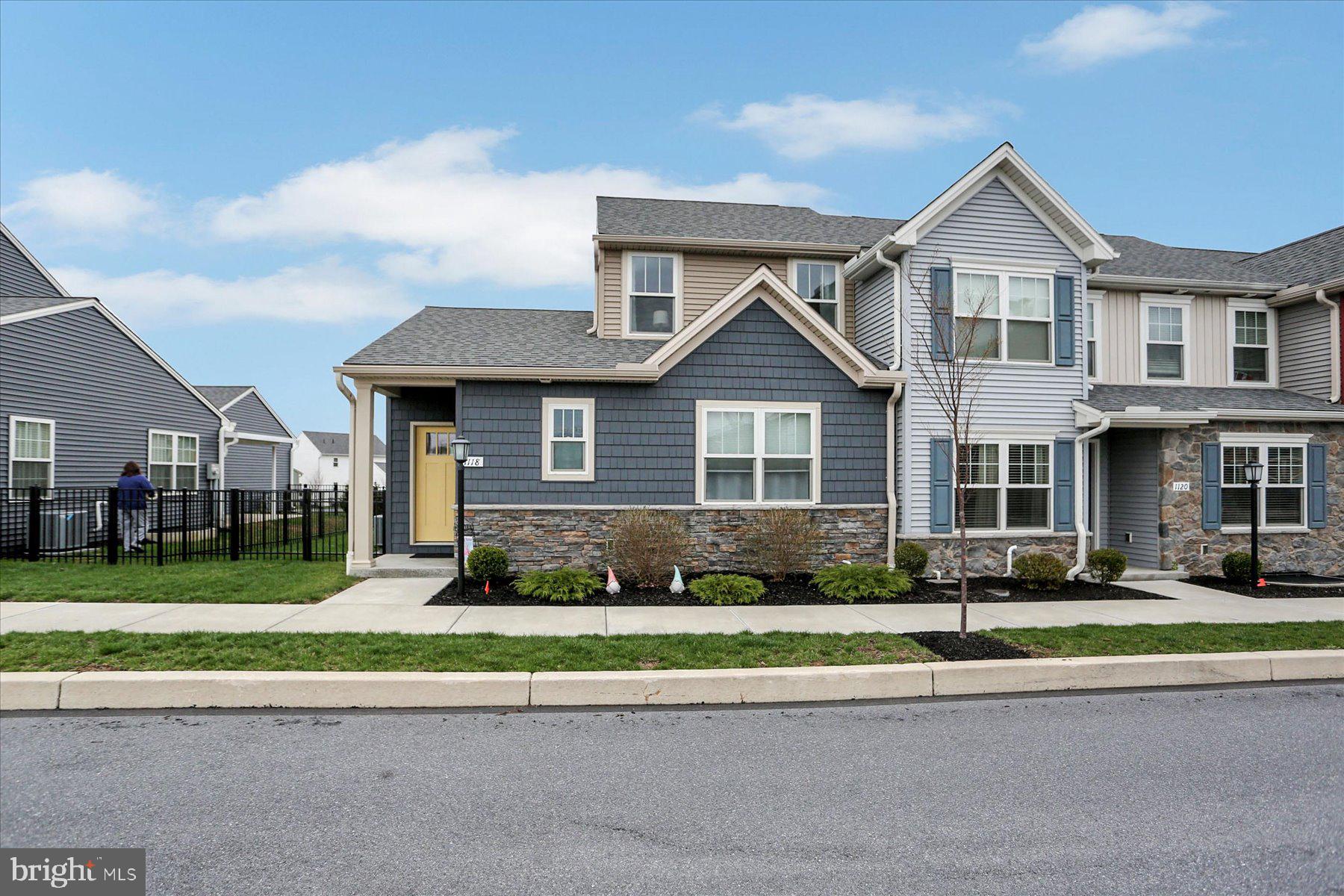 Welcome to the small-town charm of Union Station, offering an array of amenities, shopping, dining, a brewery, and scenic walking trails—all just steps from your front door. It's a vibrant life-style you'll want to experience! This beautifully designed end-unit townhome features two spacious primary suites, one on each level—perfect for flexible living arrangements or hosting guests. The main floor boasts an open-concept layout with soaring 9-foot ceilings, flooding the space with natural light. The stylish kitchen is equipped with granite countertops, stainless steel appliances, gas cooking, a pantry, a breakfast bar for 3, and plenty of space to cook and entertain. Enjoy the warmth and durability of luxury vinyl plank flooring throughout the main living areas, with plush carpeting in the bedrooms for added comfort. The oversized garage comfortably fits two mid-size SUVs with extra room for storage. The large unfinished basement, complete with an egress window, is a blank canvas ready for your personal touch—whether you’re dreaming of a home gym, media room, or extra living space. Additional highlights include a main-level laundry room with washer and dryer included, and a fenced yard with an expanded patio, ideal for pets and outdoor relaxation.