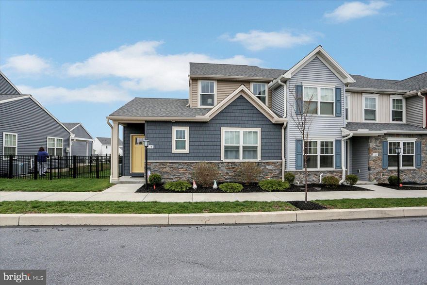 Welcome to the small-town charm of Union Station, offering an array of amenities, shopping, dining, a brewery, and scenic walking trails—all just steps from your front door.  It's a vibrant life-style you'll want to experience!  This beautifully designed end-unit townhome features two spacious primary suites, one on each level—perfect for flexible living arrangements or hosting guests. The main floor boasts an open-concept layout with soaring 9-foot ceilings, flooding the space with natural light. The stylish kitchen is equipped with granite countertops, stainless steel appliances, gas cooking, a pantry, a breakfast bar for 3, and plenty of space to cook and entertain.  Enjoy the warmth and durability of luxury vinyl plank flooring throughout the main living areas, with plush carpeting in the bedrooms for added comfort. The oversized garage comfortably fits two mid-size SUVs with extra room for storage. The large unfinished basement, complete with an egress window, is a blank canvas ready for your personal touch—whether you’re dreaming of a home gym, media room, or extra living space.  Additional highlights include a main-level laundry room with washer and dryer included, and a fenced yard with an expanded patio, ideal for pets and outdoor relaxation.