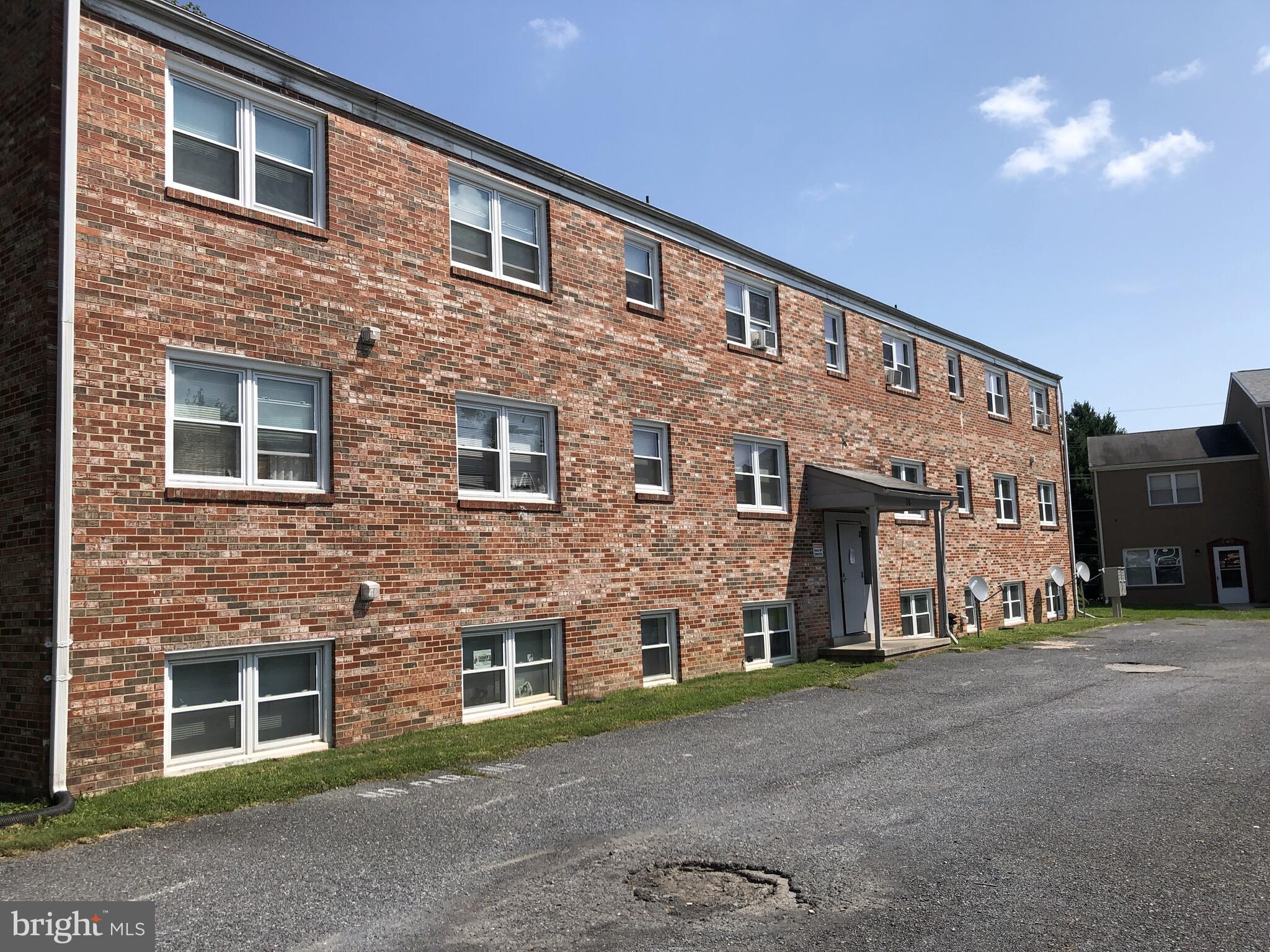 Spacious two bedroom, one bath apartment home located on the lower level. Freshly painted with new flooring throughout the unit, and updated kitchen countertops. Available for immediate move-in! Pets are allowable on an approved case by case basis.