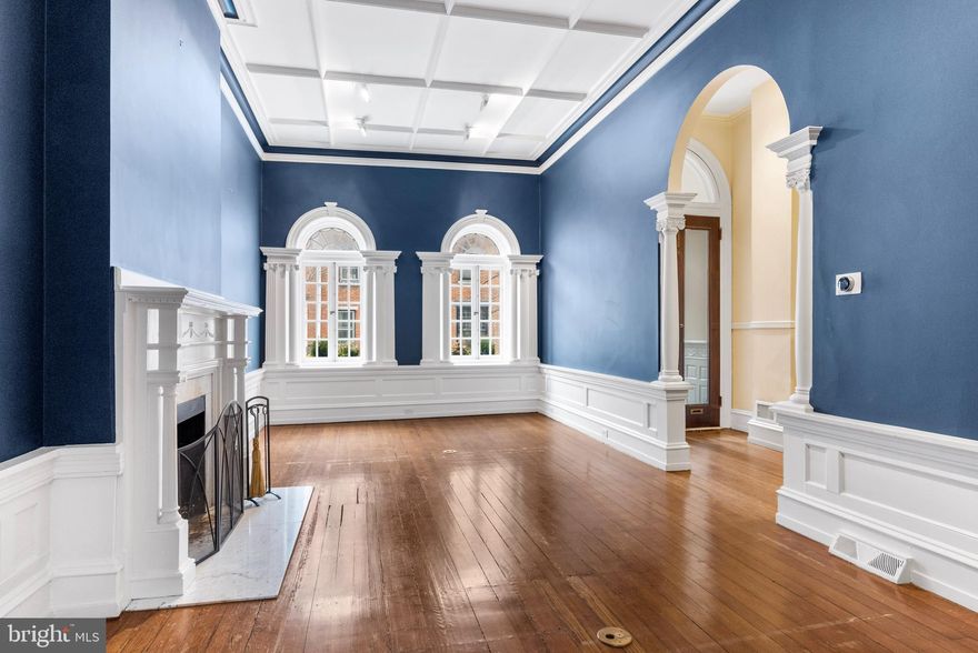 A classic Rittenhouse gem, just waiting for your inspired vision - and a little polish and shine - to elevate this historic jewel box.  Nestled in the heart of the iconic Rittenhouse Square neighborhood, this stately 3,800 s.f. four bedroom home does not sacrifice warmth and old world charm to modern functionality.   Step inside to a welcoming formal entryway, eyes drawn upwards to the dramatic soaring ceilings, and an instant sense that this is a special home.   Every room is highlighted by incredible dimension and scale and abundant natural light, with beautiful moldings and noteworthy original architectural detail - yet there is an easy accessibility and continuity of flow to the overall feel of the floor plan.   A lovely wood-burning fireplace with marble mantle and wonderful ceiling moldings accent the formal living room .  A few steps down to the first floor of the home and a more recent renovation, the expertly-fitted island kitchen is bright and spacious, boasting stainless appliances, furniture-quality cabinetry, and a cozy breakfast area.  Step outside to envision endless possibilities for a private outdoor haven, whether fire pit and grilling, a vertical succulent garden, or dinner al fresco.  A convenient powder room, and large unfinished storage/mechanical room complete this level of the home.  Opposite the formal living room on the home's main floor sits the first of two gorgeous Great Rooms, each providing fantastic flex space to create a den, formal library, home office, or communal gathering space.  Adjacent the primary level Great Room lined with original leaded glass windows and a second wood-burning fireplace, is a convenient Butler's Pantry and fully-equipped kitchen, perfect for a wet bar, preparing snacks or a light meal.  Walking up the main grand stair, to the right, a second stunning Great Room with marble fireplace, and a second convenient half bath.  At the opposite wing of this floor, light-filled with tree-top views, the primary bedroom suite features a modern bath and spacious custom walk-in.   On the next floor of the home, two charming bedroom suites and two full baths.  With every step, there is a continued mindfulness of the scale and scope of the spaces - the solidity of the home's "bones" - and a persistent awareness of the remarkable volume of the high ceilings.  The upper level of the home, via spiral stair, provides access to the rooftop deck and the last bedroom suite.  Can you envision a gorgeous rooftop deck with spectacular city skyline and sunset views, with a fantastic seating arrangement, maybe an herb garden, an alfresco mobile office, or simply relaxing with morning coffee and evening champagne?  There are endless possibilities, and this rooftop deck sits in the perfect location, awaiting your inspired vision and transformation.  The home has new mechanicals and roof,  and is being sold in its current condition.  Offering one year's prepaid parking in a nearby garage.   2221 Locust is a rare opportunity.   The perfect location four blocks from the Square,  with easy access to the river walk, I95 and University City, surrounded by the most dynamic city dining, entertainment, and shopping scene.  This historic townhome has stellar unlimited potential to become a brilliant Rittenhouse diamond.