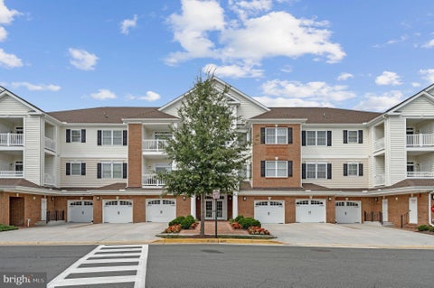 Photo of 15140 Heather Mill Lane #404, HAYMARKET, VA 20169 (MLS # VAPW2127970)