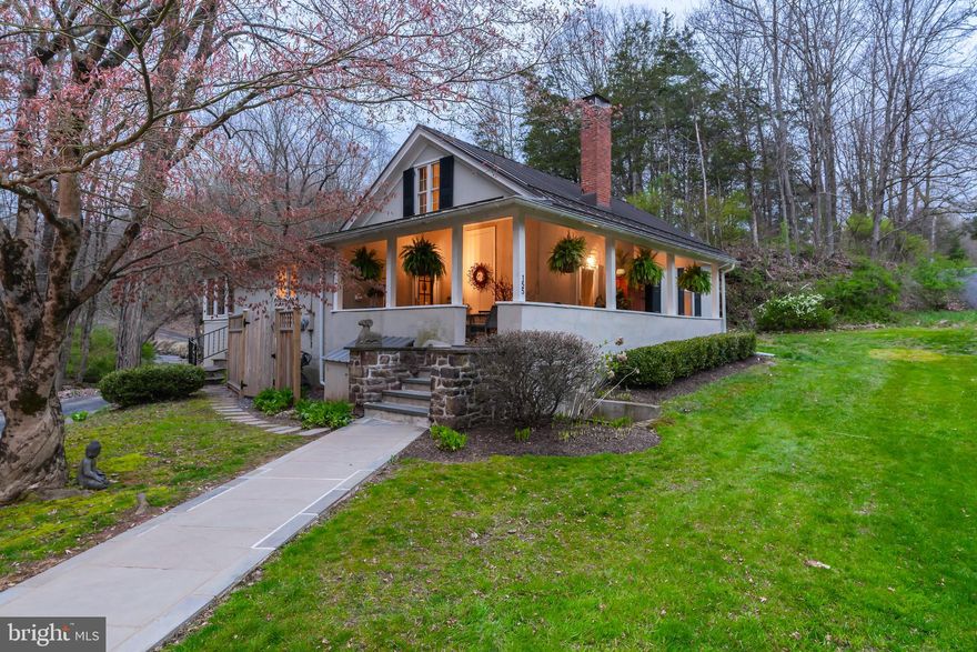 Welcome to The PERMANENT SCHOOL HOUSE. A Vintage Modern Schoolhouse meets chic renovated loft! Circa 1840’s, this schoolhouse turned one-of-a-kind Bucks County Beauty has been lovingly restored and updated to meet all one’s needs. Welcomed by a generous wrap-around covered porch, ideal for outdoor gatherings, sipping morning coffee or cocktails in the evening, it’s definitely a spot to enjoy all day long. Upon entering, the sleek and polished design will grasp your attention right away with soaring beamed ceilings, in the white-washed great room making it feel fresh and modern, although many original antique features like deep set windows, exposed stone, hand-hewn beams and period pine flooring are still in place. The floor to ceiling stone fireplace, large windows, and a storage loft sixteen feet above the room make it even more impressive. The great room is an open floor concept with lots of natural light inviting your imagination to arrange the room that best suits your needs. The kitchen is a gourmet’s delight featuring a Fisher and Paykel refrigerator, an Asko dishwasher, a Dacor gas range with a downdraft vent, and Pietra Cardoza limestone countertops, open shelving, skylights and a farm sink beneath a big window looking out onto the creek. Adjacent and open to the kitchen is the dining room surrounded by windows, custom window seating w/storage and flagstone flooring all with views of the water and could also serve as a sunroom. The charming original chalkboards were preserved in both bedrooms, each having refinished flooring, exposed painted beams and their own modernized private bathrooms. Polished touches like radiant heated floors, soapstone counters, subway tile and walk-in seamless glass showers keep everyone comfortable as does the Generac generator. The outside offers a private rear yard, plenty of parking both front and back, the original caretaker’s cottage and an outhouse across the street, along with a free-standing repointed outdoor stone fireplace. Surrounded by million-dollar homes, abutting farmland and soothing scenic creeks, all close to the Towpath, Frenchtown and historic river towns, parks, the river, and bucolic backroads with covered bridges to explore, this one should not be missed! This home is in excellent condition and absolutely turn-key, it’s ideal as a full-time residence or perfect as a get-away weekender in the country. Easy commute into NY and Philadelphia. A comprehensive full list of improvements is available.