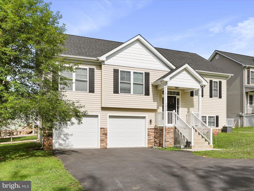 Welcome to 1613 Needy Rd, a beautifully maintained home built in 2020 that offers a perfect blend of modern comfort and everyday convenience. This 3-bedroom, 2.5-bath home is ideally situated just minutes from Route 9, the IRS campus, the VA Medical Center, and only a short drive to downtown Martinsburg, Charles Town, and Shepherdstown. Best of all, there’s no HOA. Inside, the home features gleaming hardwood floors throughout the main level, with carpeted bedrooms that add warmth and comfort. The open concept living room and kitchen create a spacious, inviting layout that is perfect for both daily living and entertaining. The gourmet kitchen is a standout, complete with granite countertops, stainless steel appliances, an ENERGY STAR smart refrigerator, and an ENERGY STAR dishwasher. The spacious primary bedroom offers a tray ceiling, walk-in closet, and a full ensuite bathroom, providing a peaceful and private retreat. A walk-out deck just off the main living area leads to a fully fenced-in backyard with a beautiful view of a pond, creating the perfect setting for relaxing or outdoor gatherings. The finished lower level adds flexible space that can be used as a family room, home office, gym, or an additional bedroom, depending on your needs. The garage has enough space to fit two cars and provide extra storage. The home is in excellent condition and move-in ready, with energy-efficient features and a great location for commuters. Don't miss your chance to own this charming and versatile home. Schedule your private showing today!