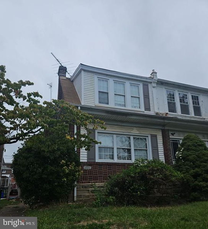 Discover the potential in this spacious, oversized brick twin home, built in 1950 and brimming with opportunity. The main level features an enclosed front porch leading into a generous living room, formal dining room, and an eat-in kitchen with direct access to the rear deck—perfect for everyday convenience or entertaining. Upstairs, you’ll find three well-sized bedrooms offering ample closet space, along with a full hall bath. The full, unfinished walk-out basement provides additional storage or the possibility for future expansion. Outside, the property includes a detached one-car garage and driveway parking, with a rear yard accessible from both the basement and deck. Conveniently located near local shopping, public transportation, and major city roadways, this home offers both comfort and accessibility. Please be advised that the property exhibits visible structural concerns along the side wall.