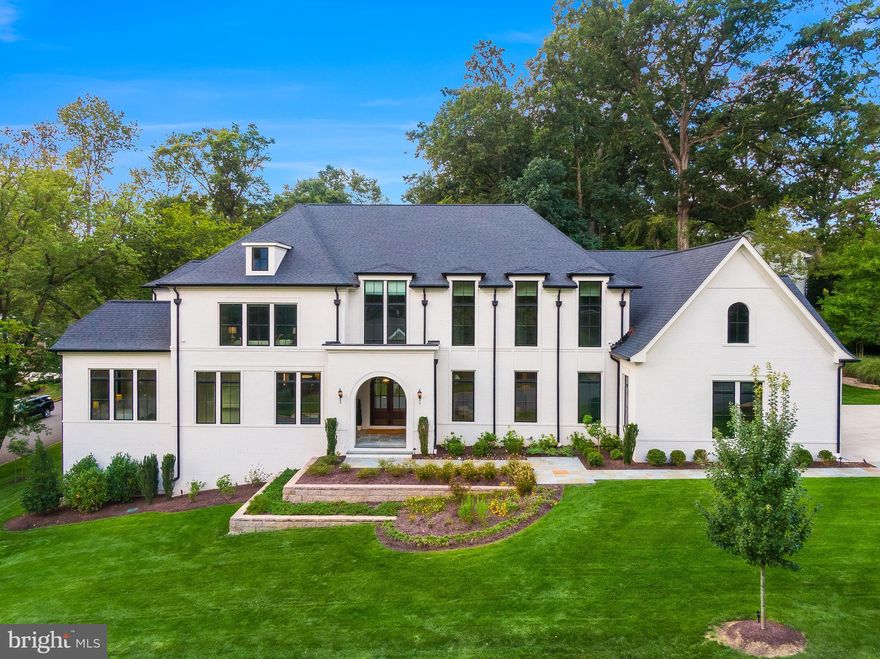 9/7 OPEN HOUSE CANCELED. SELLERS HAVE ACCEPTED AN OFFER.


Welcome to 6001 Balsam Drive, a Cherry Hill Custom Home build and a rare offering in the heart of McLean. This estate seamlessly blends timeless architecture with today’s most sought-after amenities. Set on a beautifully landscaped .52-acre lot, the 11,000+ square-foot residence is designed for both grand entertaining and intimate living.

Step inside to soaring ceilings, an elegant foyer, and natural light that pours through expansive windows. The open floor plan connects formal living and dining areas to a stunning family room anchored by a statement fireplace and custom millwork. Wide-plank hardwood floors, bespoke molding, and designer finishes create a refined yet inviting atmosphere throughout.
At the heart of the home is a chef’s kitchen featuring an eight-burner range, professional-grade appliances, an oversized quartz island and counters, and custom cabinetry. A separate scullery/catering kitchen ensures effortless entertaining, whether hosting an intimate dinner or a gala-style event. The adjoining breakfast area and family room open to a large deck and a screened porch complete with a gas fireplace and ceiling heaters. The kitchen connects to the dining room via a large wet bar and a glass-enclosed wine storage room. A main-level office provides a quiet retreat with floor-to-ceiling custom built-ins.
Practicality meets elegance with a spacious mudroom, pantry, a secondary laundry area, pet shower, and half bath that connect the kitchen to the oversized three-car garage. Additional storage and a secondary staircase to the upper level enhance functionality.

The primary suite is a sanctuary, featuring an upper-level loft retreat/great room, spa-inspired bath with heated floors, and a boutique-style dressing room. Throughout the home, custom window treatments add both beauty and function, including bedroom blackout shades. Five additional en-suite bedrooms are complemented by three well placed half-baths, ensure comfort and convenience for family and guests.

The lower level is an entertainer’s dream with a spacious den, wellness studio, recreation lounge with full wet bar, and a flexible space ideal for a media room or golf simulator. A large finished storage area provides abundant space for organization. Two laundry rooms, one upstairs and one on the main level, offer everyday convenience.
Curb appeal is enhanced by extensive professional landscaping, RainBird irrigation, and custom landscape lighting.

Everyday living is elevated by thoughtful details including an electric car charging outlet in the garage, built-in speakers, and whole-home technology features. The residence is also elevator-ready, with oversized elevator closets serving all three levels.
Ideally located, this home offers easy access to downtown McLean, Tysons Corner, and Washington, D.C., while preserving a sense of privacy and retreat. Premier shopping and fine dining are just minutes away.