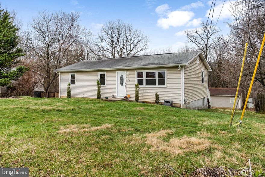 Easy one-level living just minutes from Shepherdstown and Shepherd University. This well-maintained home offers a bright, functional layout with a kitchen featuring granite countertops, ample cabinet storage, and generous counter space that opens to the dining area. The home includes three nicely sized bedrooms, laminate flooring, and a convenient laundry closet. Step outside to a spacious rear deck overlooking a private backyard with woods behind the property, providing a peaceful setting for relaxing or entertaining. An oversized two-car garage and plenty of parking add to the home's convenience. Ideally located close to shopping, dining, and everyday amenities while still offering a quiet, comfortable setting.