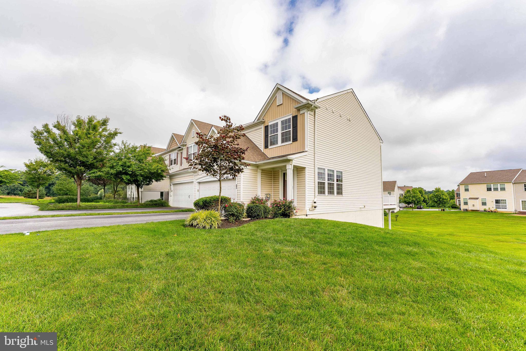 Welcome to 38 Clement Court, a beautifully maintained 3-bedroom, 2.5-bath end-unit townhome in the highly sought-after Towns community of Applecross in Downingtown. As you enter the home, you're greeted by a warm and inviting foyer featuring hardwood floors, a dome light, chair rail, and classic wainscoting. Continue down the hallway to the spacious living room, complete with hardwood floors, a ceiling fan with light, and a cozy fireplace with a new mantle and glass screen—perfect for relaxing evenings. Just off the living room is a convenient powder room with tile flooring. The adjacent dining room boasts hardwood floors, crown molding, chair rail, wainscoting, and sliding glass doors that lead to a composite deck—ideal for outdoor entertaining or quiet mornings with coffee. A large pass-through connects the dining area to the well-appointed kitchen, which features tile floors, granite countertops, a tile backsplash, rich cherry cabinetry, stainless steel appliances, a double sink, and a pantry closet. The kitchen also offers direct access to the attached two-car garage for added convenience. Upstairs, a hallway linen closet houses the washer and dryer for easy laundry access. The primary bedroom features hardwood flooring and a ceiling fan with light, while the en-suite bathroom includes tile flooring, a step-in tile shower, a dual-sink vanity, and a spacious walk-in closet with carpeted floors. Two additional bedrooms—both with hardwood floors and ceiling fans—offer perfect spaces for children, guests, or a home office. A second full bathroom on this level features tile flooring and a tile tub/shower combo. The fully finished basement adds even more living space, featuring luxury vinyl plank flooring, a large family room with a walk-in closet for storage, a utility closet, a projector and screen for movie nights, and a walk-out to the backyard. There's also a dedicated home office with a bold red accent wall, ideal for working from home. Upgraded gas furnace in 2025! Beyond the home itself, the Applecross community offers an impressive array of amenities including a golf course and country club, fitness center, indoor and outdoor pools, tennis courts, walking trails, a clubhouse restaurant, and a welcoming community center. Don’t miss the opportunity to make this exceptional home yours—schedule your tour today!