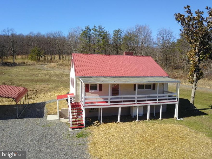Rawlings, MD – Totally Restored & Remodeled Family Farmhouse Perched on 18+ Flat Gentle Rolling Acres w high Traffic Volume on US Rte #220. Large Front Covered Porch leads to roomy Interior which includes Eat-in Kitchen w All New Appliances, Granite Countertops, & Ceramic Tile Floors. Living Room offers New Laminated H-Wood Floors, (2) Bedrooms & Full Bath w New Shower/Tub Combo.  2 Bedrooms and Full Bath on 2nd Flr.  Full Unfinished Basement w Exterior Access. Other amenities: Large Detached Garage (TLC), Carport, Workshop, 2 Separate Front Lots with Water/Sewer and Underground Electric, Vinyl Siding, Oil, Propane & Electric BB Heat.  This is a Multiple Use Property with Excellent Potential for Additional Income.  Call for more info, you won’t Regret it!