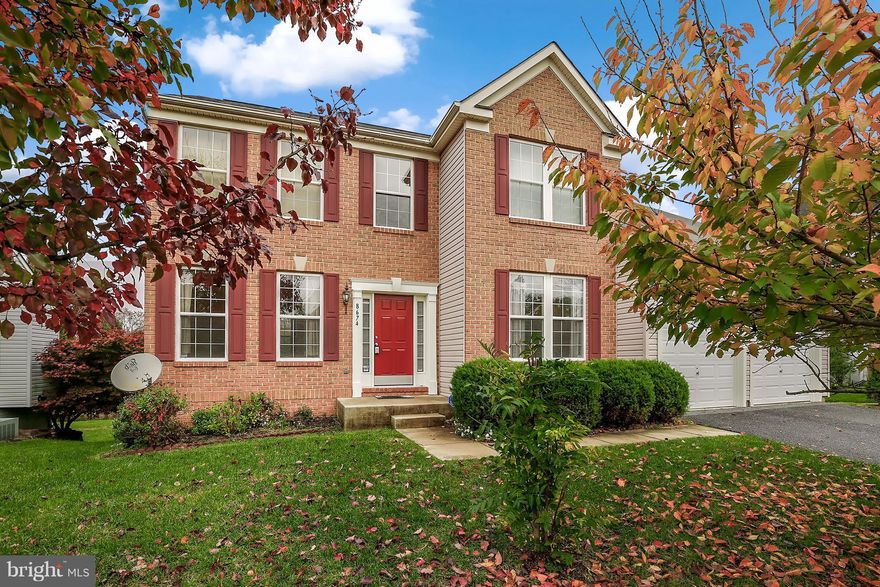Outstanding brick front colonial that is like new and move-in ready!  Offering a two story foyer, gleaming HW floors, fresh paint, new carpet, updated Kit w/granite & new SS app, formal DR & LR w/crown molding, sunken FR w/fireplace, maint free deck overlooking a flat yard backing to trees & open space, main lvl library, master suite w/luxury BA & HUGE WIC, walk out bsmt w/rough-in.