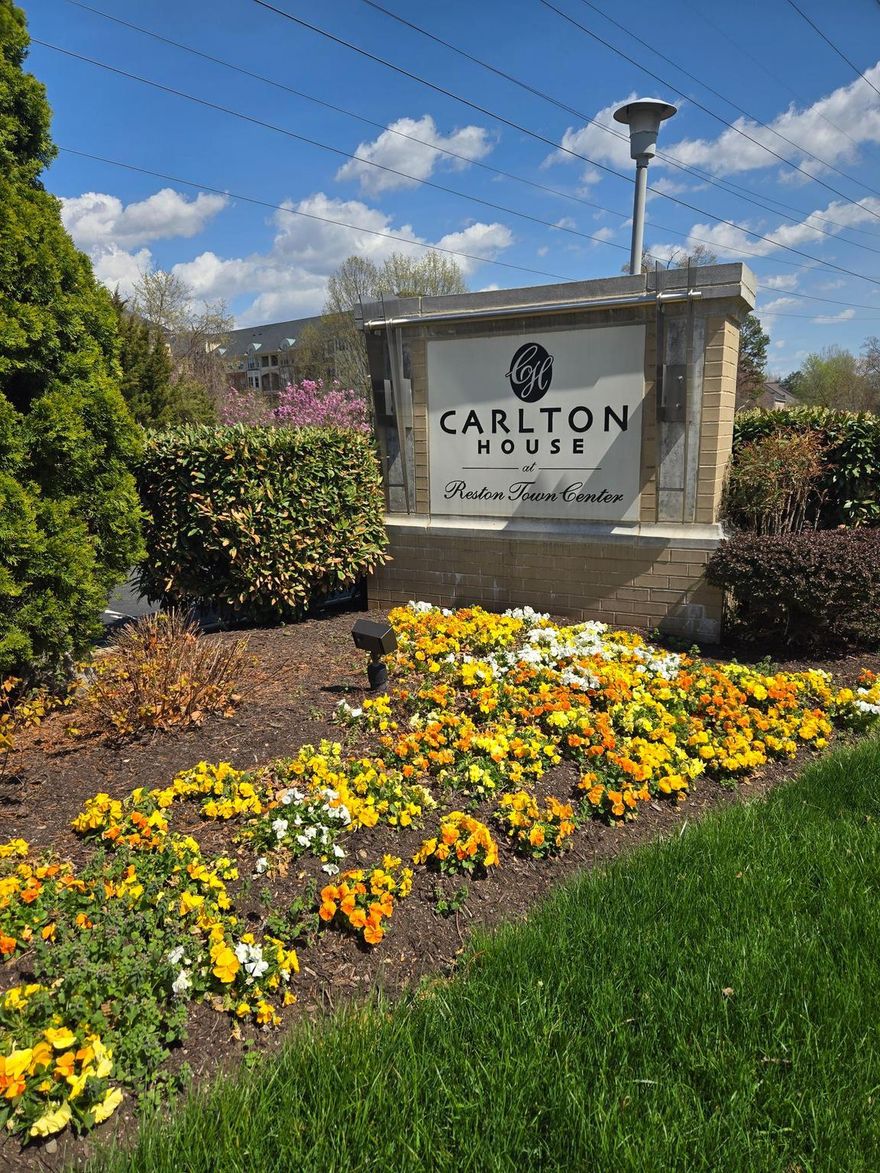 Move-in ready, this stunning 1-bedroom condo is freshly painted and featuring numerous recent upgrades, including a 2-year-old HVAC system, new Nest thermostat, water heater, and disposal, ensuring peace of mind for years to come. The bedroom boasts newer flooring (2 years old), while stylish vinyl flooring flows throughout the rest of the home. Enjoy enhanced efficiency with an upgraded energy-saving toilet and a sleek, modern bathtub enclosure. 
Welcome to elevated living at The Carlton House in the heart of Reston. This beautifully maintained and secure building offers the perfect blend of comfort, convenience, and luxury. Designed with entertaining in mind, the open floor plan offers seamless flow and abundant natural light. The enclosed sunroom overlooking mature trees provides the perfect space for a home office, reading nook, or simply relaxing with your morning coffee. The spacious primary bedroom includes a generous walk-in closet for ample storage. Residents of The Carlton House enjoy exceptional amenities, including a rooftop pool, fitness center, billiards room, concierge service, and secure entry—everything you need to unwind after a long day. The unit also includes one dedicated garage parking space. Located just steps from both the Wiehle-Reston East Metro Station and Reston Town Center Metro Station, commuting is effortless. You’re also within walking distance to premier shopping, dining, and year-round events at Reston Town Center. This is more than a condo—it’s a lifestyle. Don’t miss your opportunity to call this exceptional home yours!