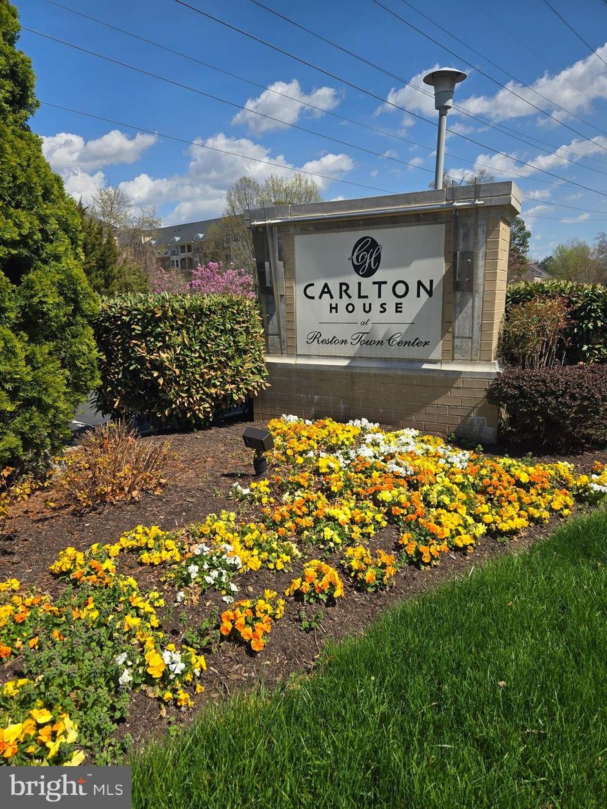 Move-in ready, this stunning 1-bedroom condo is freshly painted and featuring numerous recent upgrades, including a 2-year-old HVAC system, new Nest thermostat, water heater, and disposal, ensuring peace of mind for years to come. The bedroom boasts newer flooring (2 years old), while stylish vinyl flooring flows throughout the rest of the home. Enjoy enhanced efficiency with an upgraded energy-saving toilet and a sleek, modern bathtub enclosure. 
Welcome to elevated living at The Carlton House in the heart of Reston. This beautifully maintained and secure building offers the perfect blend of comfort, convenience, and luxury. Designed with entertaining in mind, the open floor plan offers seamless flow and abundant natural light. The enclosed sunroom overlooking mature trees provides the perfect space for a home office, reading nook, or simply relaxing with your morning coffee. The spacious primary bedroom includes a generous walk-in closet for ample storage. Residents of The Carlton House enjoy exceptional amenities, including a rooftop pool, fitness center, billiards room, concierge service, and secure entry—everything you need to unwind after a long day. The unit also includes one dedicated garage parking space. Located just steps from both the Wiehle-Reston East Metro Station and Reston Town Center Metro Station, commuting is effortless. You’re also within walking distance to premier shopping, dining, and year-round events at Reston Town Center. This is more than a condo—it’s a lifestyle. Don’t miss your opportunity to call this exceptional home yours!