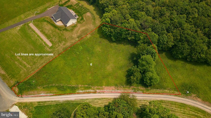 Breathtaking views just minutes to Deep Creek Lake and Wisp Ski Resort between McHenry and Accident.  This homesite in Rocklick Creek Estates has been approved for a four bedroom perc, affording you endless possibilities to build your dream home. All utilities including electric, cable tv, and internet are already directly to the lot line. The driveway entrance has also been started. The location is also just minutes to I-68, making this an ideal location for a permanent residence or a great vacation spot.