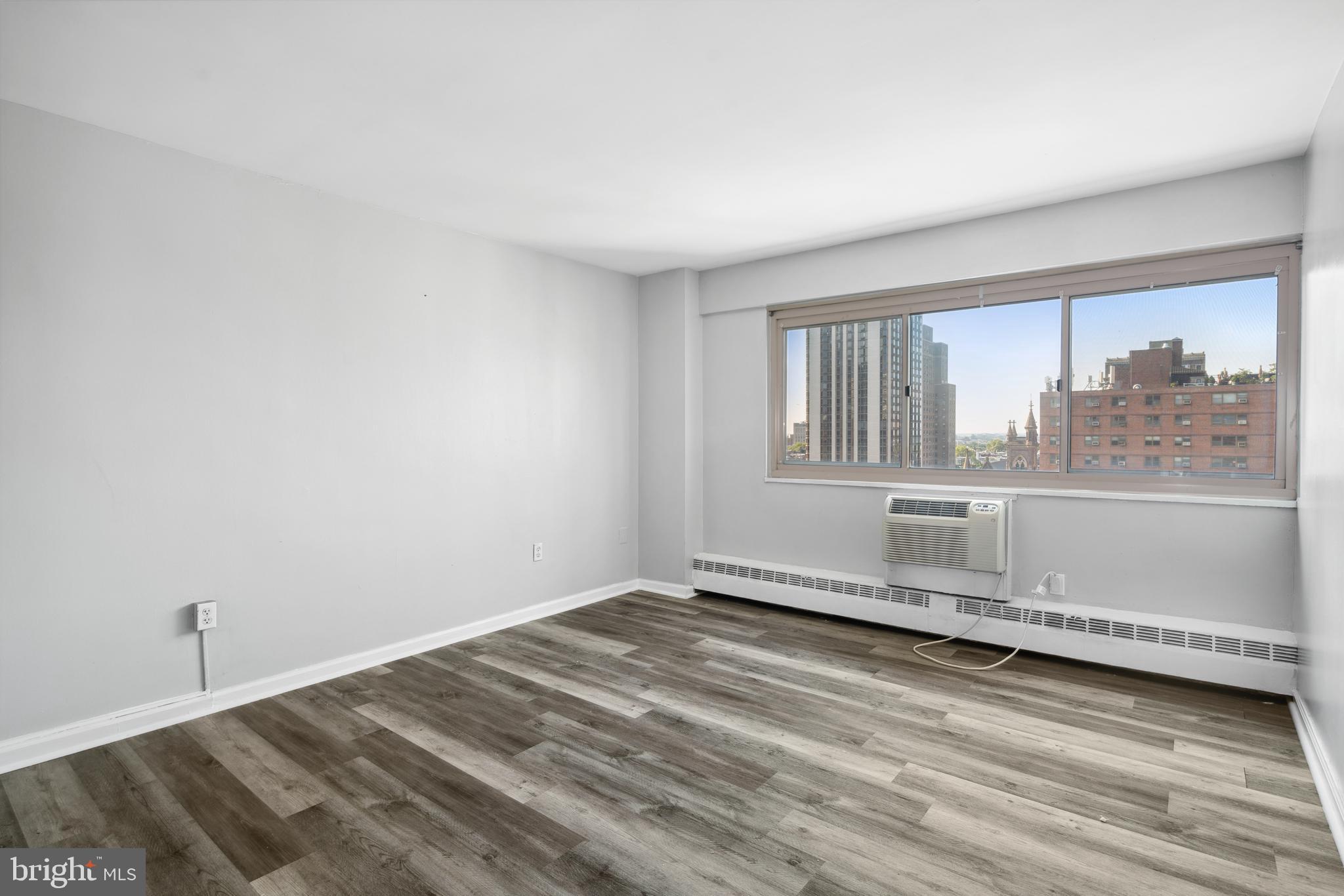 Say hello to this fantastic light filled 1-bedroom condominium located in the highly sought-after Rittenhouse neighborhood. This spacious unit offers an open floor plan featuring a wall of windows with upgraded flooring and amazing unobstructed city views. The generously-sized bedroom has great closet space and showcases the stunning views. The bathroom has been updated with designer floor and wall tiles. The RiverWest Condominium monthly HOA fee includes your electricity, heat, A/C, gas, hot and cold water, sewer, trash removal, and basic TV cable. It also includes secured access entry, a newly renovated lobby, 24-hour front desk attendants , media/business center, state-of -the -art fitness center and FREE Wi-Fi in common areas. This highly sought after location puts you within walking distance of great dining, shopping, museums, theaters, Giant, Whole Foods, and Trader Joe's Supermarkets. You'll also be an easy stroll to the beautiful Rittenhouse Square Park and the Schuylkill River Trail. Con