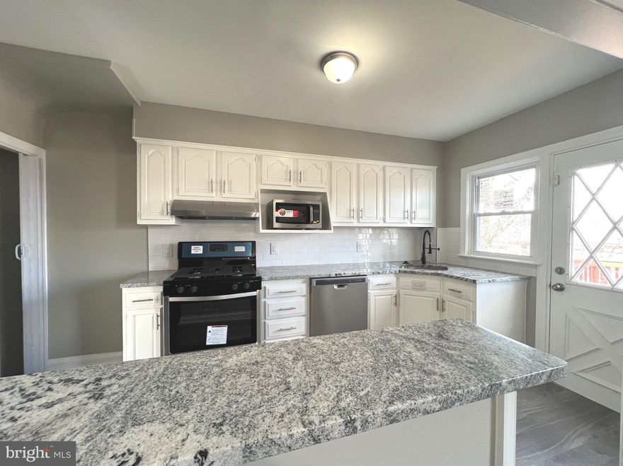 This extraordinary rare find in delightful Ednor Gardens is move-in ready.  Neutral color palette and on-trend flooring will make decorating a breeze.  Stainless steel appliances and natural stone countertops make the open-concept kitchen pop!  An upper level deck is the perfect place to brunch.  This spacious three-bedroom, one and a half bath is located less than two miles from Johns Hopkins University & Morgan State University.  Enjoy easily accessible community amenities such as the Waverly Farmer's market, Lake Montebello, and the Weinberg Y at Waverly.  Conveniently located whether walking, biking, or driving...less than 20-minute commute to downtown.  Still teleworking? Lower level living area offers plenty of space for a home office or a hang-out.  Relax at the end of the day in the large, level, fenced yard.  Backyard barbeques and the best of times await!