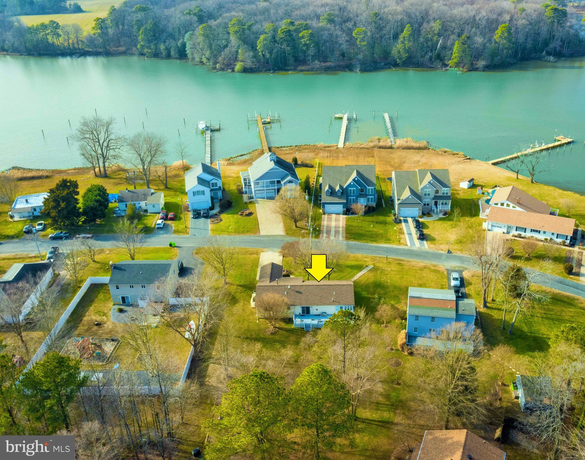 HERE IS WHAT YOU'VE BEEN WAITING FOR! WATERVIEWS & SUNSETS & BOAT RAMP ACROSS THE STREET. LIVE LIKE YOU'RE ON THE WATER WITHOUT WATERFRONT TAXES! Hardwood floors and huge sunroom that would make even Jimmy Buffet smile. Very quiet community. Don't miss out on this opportunity to live on KI with so many activities close by, great waterfront parks, shopping and fine restaurants.