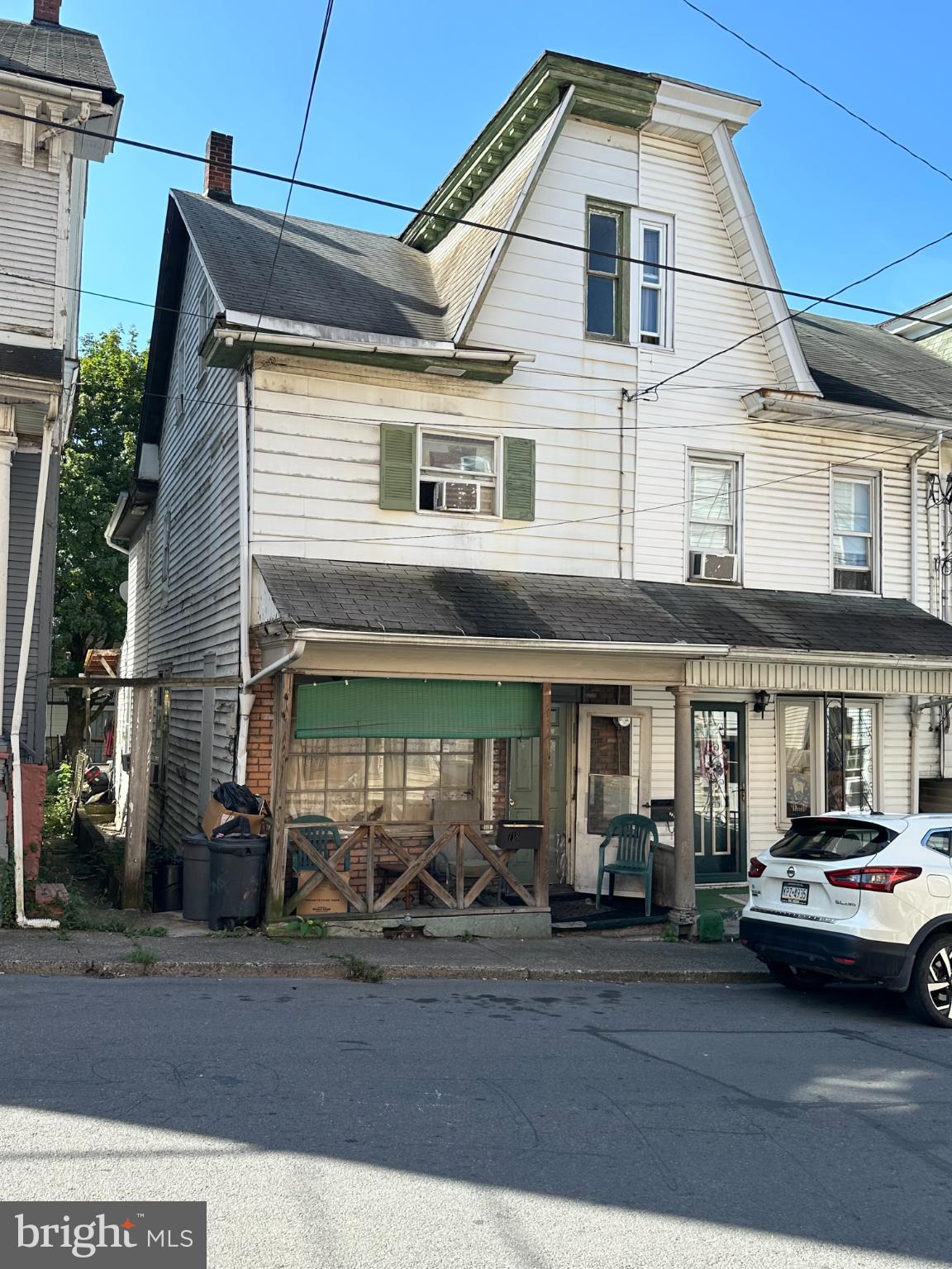 This twin/semi-detached home, built in 1910, offers a blend of traditional architecture and modern potential, making it an attractive investment opportunity. Located in the City of Shamokin, this property features three spacious bedrooms and a full bathroom, ideal for rental or resale. The interior living and dining areas boasts hardwood flooring, enhancing both aesthetic appeal and maintenance ease. Appliances include an electric dryer and washer, located on the main floor. The rear yard offers outdoor space for relaxation or recreation, appealing to prospective renters or buyers seeking outdoor amenities. Situated in the middle of the block, the property benefits from a quiet residential atmosphere while remaining accessible to local amenities. On-street public parking ensures convenience for residents and guests alike. With a solid structure, this property is poised for strong rental returns or appreciation in value. Investors will appreciate the low maintenance requirements and the potential for capitalizing on the growing demand in the area. This property is a prime candidate for those looking to expand their real estate portfolio. Contact Jina to schedule your private showing today, (717) 348-1222.