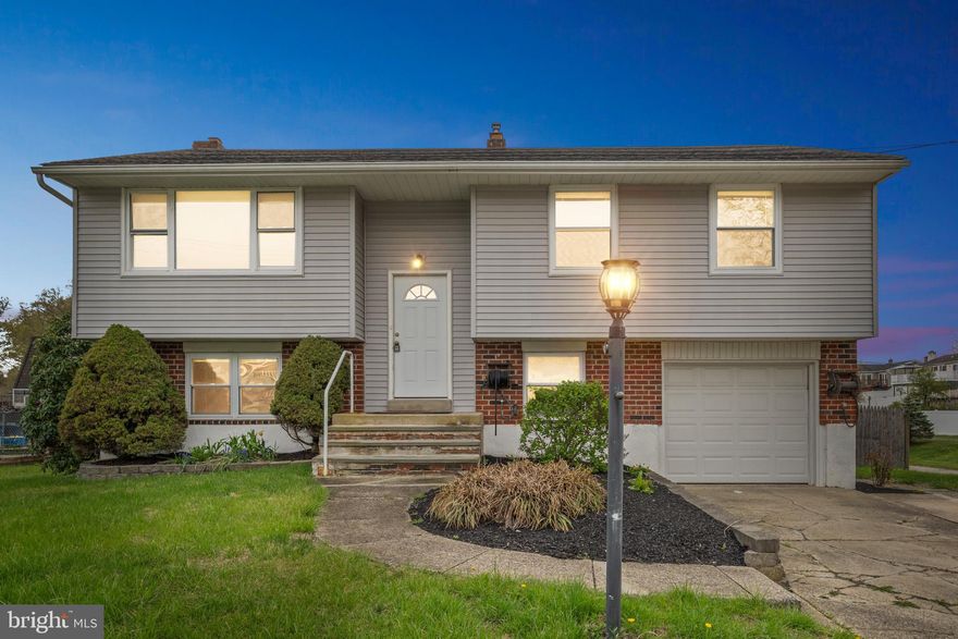 Welcome to this beautifully updated bi-level home located in the desirable Woodbrook neighborhood of Aston, PA. Freshly painted throughout, this home features a modern kitchen and stylishly renovated bathrooms. The upper level boasts a spacious open layout with a bright living room, dining area, full bathroom, and three generously sized bedrooms. The fully finished lower level offers a cozy family room with a charming brick fireplace, a convenient powder room, and direct access to the garage. Step outside to enjoy the large deck just off the kitchen—perfect for entertaining—and a massive, fully fenced backyard that backs directly to the scenic Weir Park.