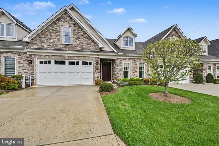 55+ Villa style in desirable Bentley Ridge  -  MAIN FLOOR PRIMARY BEDROOM  +  LUXURY BATH  +  MAIN FLOOR LAUNDRY  +  2 CAR GARAGE  +  YARD MAINTENANCE  for a carefree lifestyle.  You'll love the liveability of this open floor plan,  which still offers 'big house' features like a formal foyer,  formal dining room,  first floor den/office,  breakfast room,  upstairs den and 9 foot ceilings.   The first floor primary  bedroom suite features a full bath with walk-in shower & seating,  double vanity & large walk-in closet,  while 2 upstairs bedrooms are graciously sized and sport their own sitting room.   The large living room with gas fireplace opens to the gourmet kitchen with top of the line appliances,   gorgeous 42" cherry cabinetry and an island big enough for grandchildren and guests!   The breakfast room overlooks a nicely sized back patio and is the perfect place to enjoy your morning coffee or spread out with a big craft project.  The 1st floor laundry opens to a 2 car garage with plenty of extra room for storage.   There's also a large  'hidden' parking lot with plenty of overflow parking for guests - have a look, it's just across from the gazebo and green space.   And speaking of green space, the yards and open spaces are beautifully maintained - you don't have to lift a finger!  You're just five minutes to Wegmans, shops and dining at Boulevard at Box Hill.