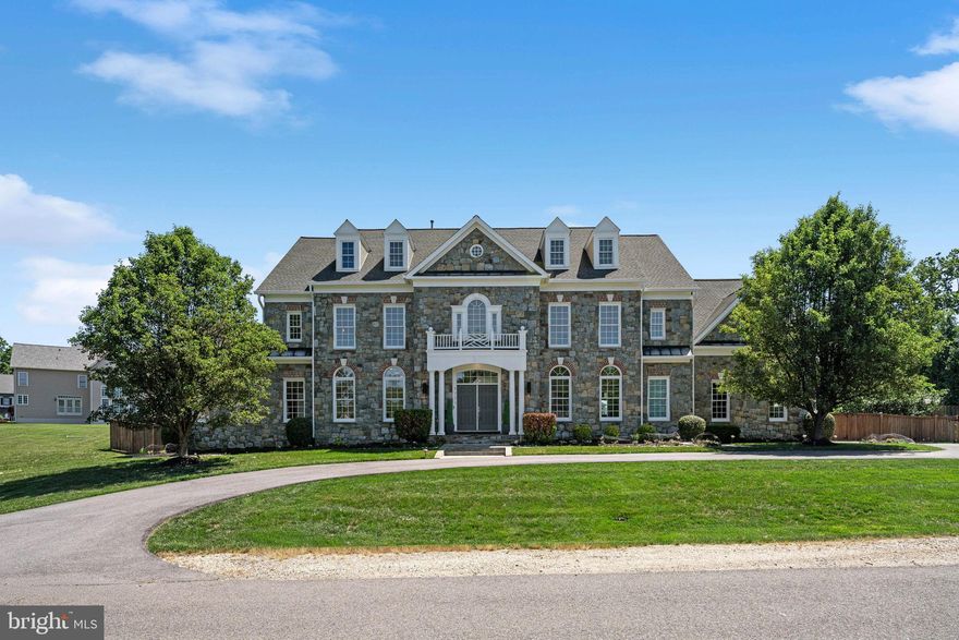 FULLY RENOVATED LUXURY HOME IN THE HEART OF LORTON! This stunning 4-level residence offers 6 spacious bedrooms and 7.5 bath, highlighted soaring 24-FT CEILINGS and high-end finishes throughout. Enjoy true resort- style living with exceptional indoor and outdoor spaces designed for both comfort and entertaining -all in a prime location just minutes to I-95 for an easy commute.

• HEATED POOL & HOT TUB SPA
• PRIVATE FENCED BACKYARD
• EXPANSIVE PATIO – PERFECT FOR ENTERTAINING
• 4 FINISHED LEVELS WITH GENEROUS LIVING SPACE
• DEDICATED THEATER ROOM
• 6 BEDROOMS | 7.5 BATHS
• GRAND 24-FT CEILINGS
• WALKING DISTANCE TO THE OCCOQUAN RIVER FROM THE END OF THE CUL-DE-SAC
• MINUTES TO I-95 – IDEAL FOR COMMUTERS

A rare blend of ELEGANCE, SPACE, LOCATION, AND MODERN UPGRADES—THIS HOME TRULY HAS IT ALL!

From the moment you enter, you are welcomed by abundant natural light pouring through oversized windows, highlighting the home’s elegant design and spacious open layout. Freshly painted interiors, new flooring, and luxurious finishes create a sophisticated yet comfortable living experience. The main level showcases beautiful tile flooring, while the basement features luxury vinyl flooring designed for both style and durability. Plush new carpeting on the bedroom level adds warmth and comfort to the private living spaces.

Designed for both entertaining and everyday living, this home offers incredible flexibility and functionality. The expansive basement is an entertainer’s dream featuring a huge custom bar, home theater, gym area, indoor recreation/play space, and ample room to host gatherings of any size. Every room has been designed with space and comfort in mind, allowing everyone in the household to enjoy their own private retreat while still offering wonderful spaces to come together.

A main-level bedroom with an attached full bath provides the perfect option for guests, multigenerational living, or a private home office. The spacious layout flows effortlessly throughout the home, making it ideal for celebrating holidays, entertaining family and friends, or simply enjoying peaceful everyday living.

Step outside into your own private oasis featuring beautifully landscaped grounds and a fully fenced backyard designed for both privacy and relaxation. The fence and pool with jacuzzi were newly constructed in 2021, creating an incredible outdoor setting perfect for summer enjoyment and entertaining. Surrounded by mature trees and nature, you’ll wake up to birds chirping in the morning and enjoy the peaceful charm of this quiet, established neighborhood where children can safely play outdoors.

Located just a short two-minute walk from the beautiful Occoquan River, this home offers a rare opportunity to enjoy nature, tranquility, and luxury living all in one. Conveniently situated near highly rated schools, major commuter routes, shopping, dining, and parks, this property combines elegance, functionality, and an unbeatable location.

This is more than just a home — it’s a lifestyle of luxury, serenity, and timeless comfort.