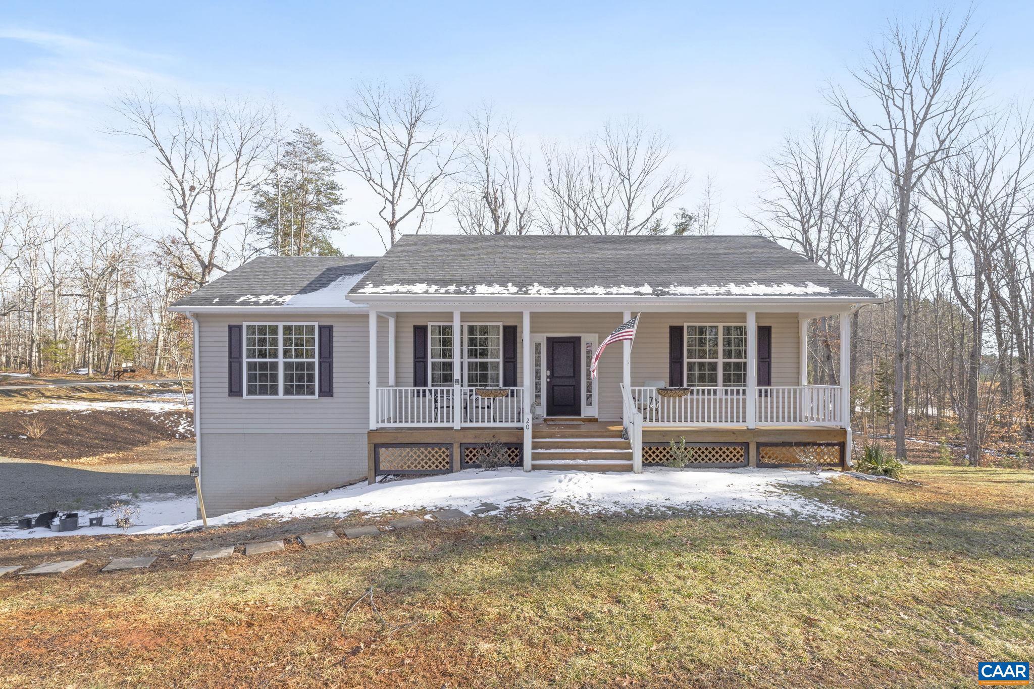 Come and take a look at this light filled home in the country on almost two acres. Enjoy the cathedral and nine foot ceilings, hickory hardwood floors, stainless steel appliances, 42 inch cabinets,wood burning fireplace in the lower level. Freshly painted and waiting you to come home. The yard is partially fenced for your animals friends. Enjoy the deck off the dining room or rock away on the front porch.,Granite Counter,Fireplace in Basement