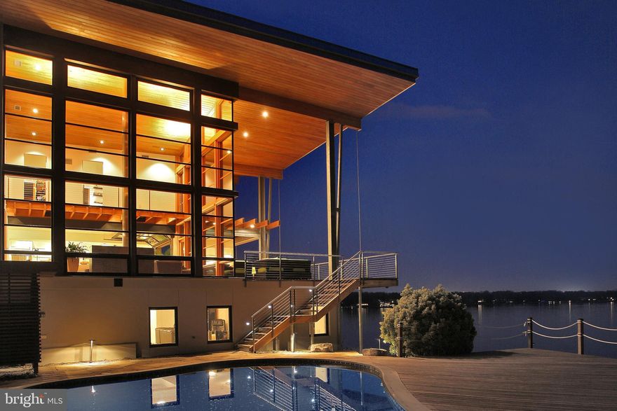 The Bay House. Spectacular waterfront setting for this AIA (American Institute of Architects) award winning home with dramatic, South River and Chesapeake Bay views, deepwater pier and waterside pool. Completely environmentally sensitive with holistic design, bold lines and architectural detail.  High performance building envelope with monthly average electric bill of $50/month! Open floor plan, uninterrupted expanses of windows optimally oriented for views and passive heating & cooling. 2-story living room provides upper loft rooms views of the water.  Outdoor living areas with expansive waterviews and cool Bay breezes providing ideal conditions for summer entertaining. This residence has achieved a LEED GOLD rating (Leadership in Energy and Environmental Design).  Pre-qualification required for showings. Listing agent to accompany.