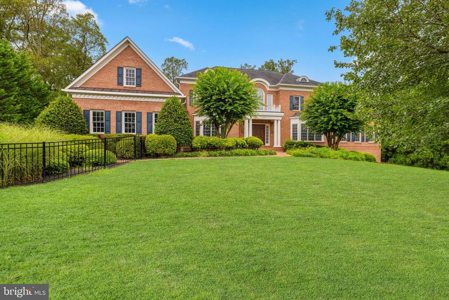 Set on a beautifully landscaped lot in the coveted Foxhall of McLean neighborhood, 1200 Hunters Grove Ct., is an extraordinary three-level Colonial offering approximately 12,600 square feet of refined living spaces, blending timeless elegance with modern luxury. With six bedrooms, five full baths, and four half baths, the home is thoughtfully designed for grand entertaining, private relaxation, and comfortable everyday living. Soaring ceilings, abundant natural light, and an elevator servicing all levels create an unmatched sense of scale and ease. A gracious covered front porch welcomes you into the grand foyer, where formal living and dining rooms, each anchored by a gas fireplace, set the tone for the home’s sophisticated style. The dining room connects to the rear of the home through a well-appointed butler’s pantry, leading seamlessly to the gourmet kitchen and adjoining breakfast room. The breakfast room opens to a sunroom and a rear deck, while the expansive great room provides the perfect gathering space. The right wing of the main level is dedicated to the serene primary suite, complete with a spacious sitting room, spa-like bath, and dual walk-in closets. A handsome study, laundry room, two powder rooms, and easy access to the three-car garage complete this level. The upper level is a private retreat, featuring three ensuite bedrooms with walk-in closets, as well as an additional bedroom offering flexibility for guests or family alike. The lower level is designed for both leisure and entertainment. A large recreation room with a gas fireplace flows into a lounge with a kitchenette on one side, and a billiards room with its own gas fireplace and adjacent den on the other, currently serving as a home gym. These spaces open to a rear patio with a sparkling pool, hot tub, and built-in BBQ area, creating an ideal backdrop for indoor-outdoor living. The lower level also boasts an additional bedroom, a dedicated office, a home theater, a full bathroom, two powder rooms, and generous storage spaces. 1200 Hunters Grove Ct. combines classic architectural detailing with modern amenities, offering a rare opportunity to own a property in one of McLean’s most desired neighborhoods.
