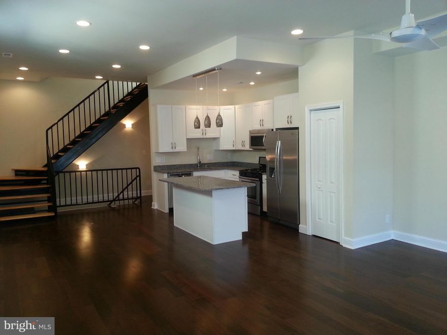 This fabulous renovation of a Victorian storefront is now complete. The property is designed as a residence with parking for one car in the rear. Because of its previous storefront use the interior is quite lofty and open with tall ceilings. The renovation is tasteful and contemporary. The lower level includes a bedroom and bath. The 3 bedrooms are en suite,plus a rooftop deck w/views.